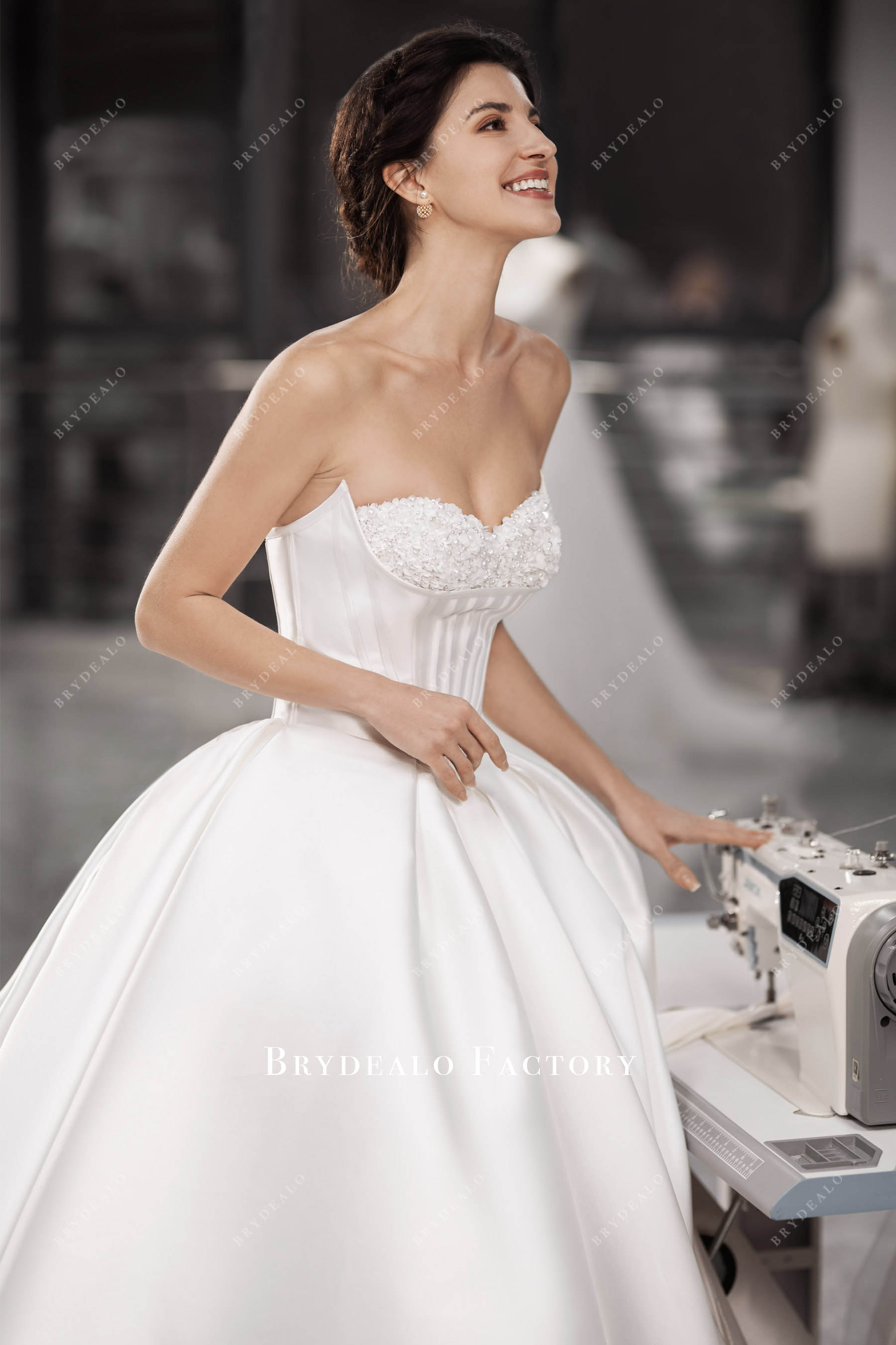 hand-sewn flower strapless sweetheart neck wedding gown