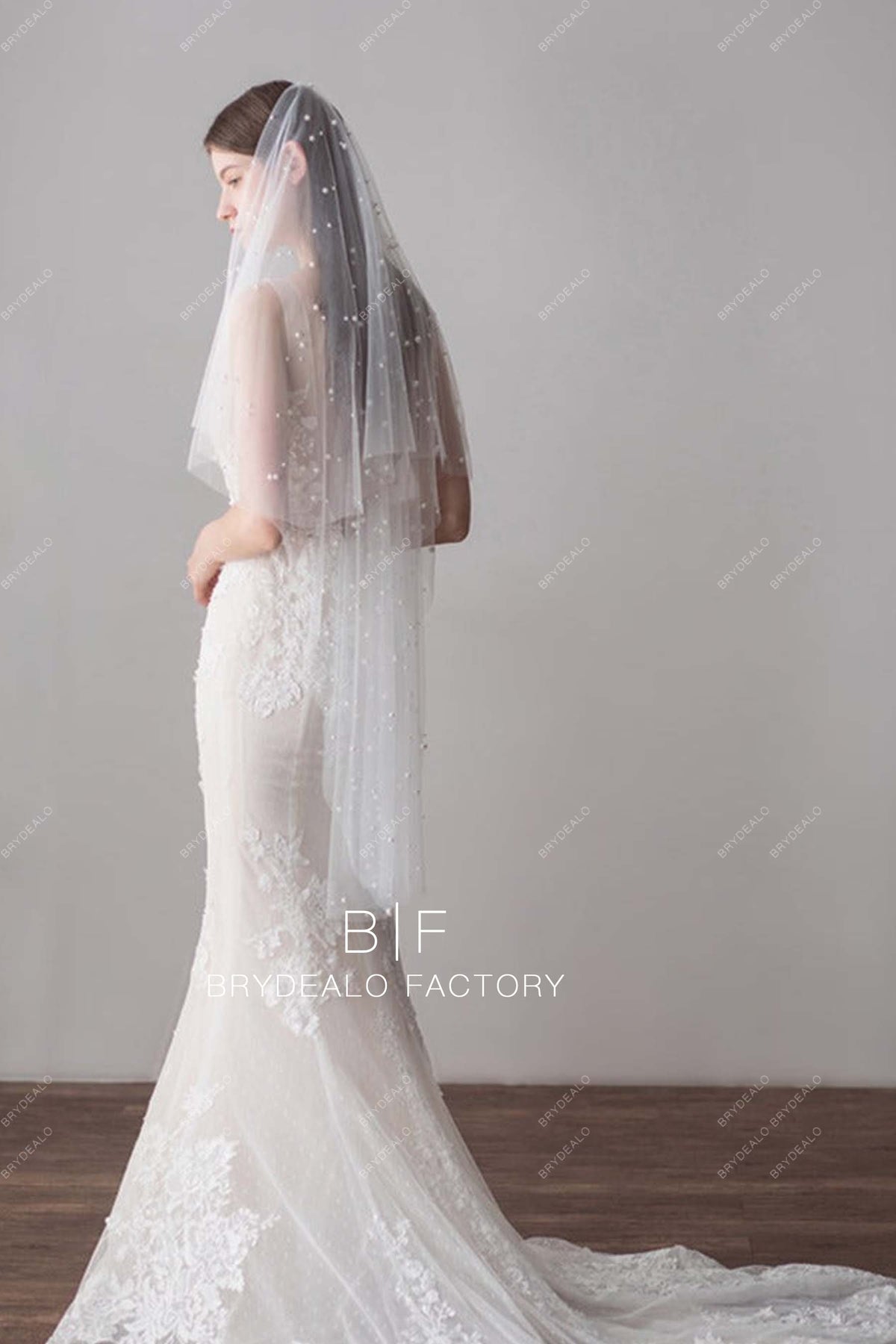http://brydealo.com/cdn/shop/products/fingertip-length-veil-pearls-cascading-bridal-veil_f44da38b-2827-48cd-9028-2182aa4b5e96.jpg?v=1686364357&width=1200