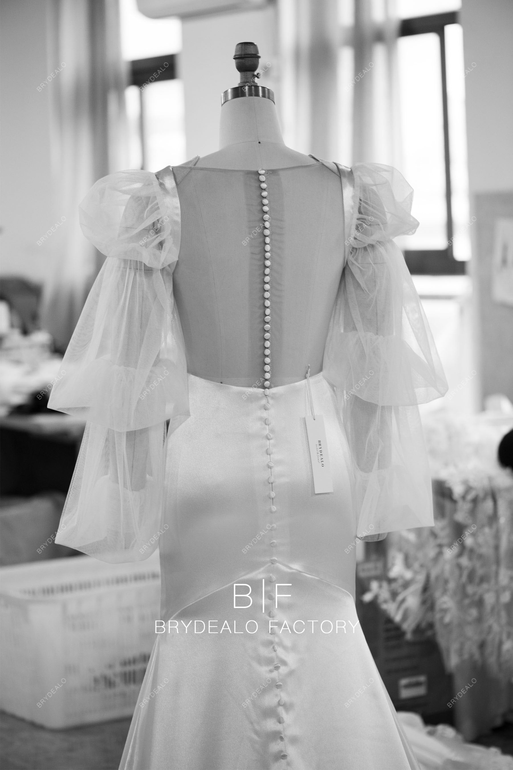 designed buttoned sheer back wedding dress