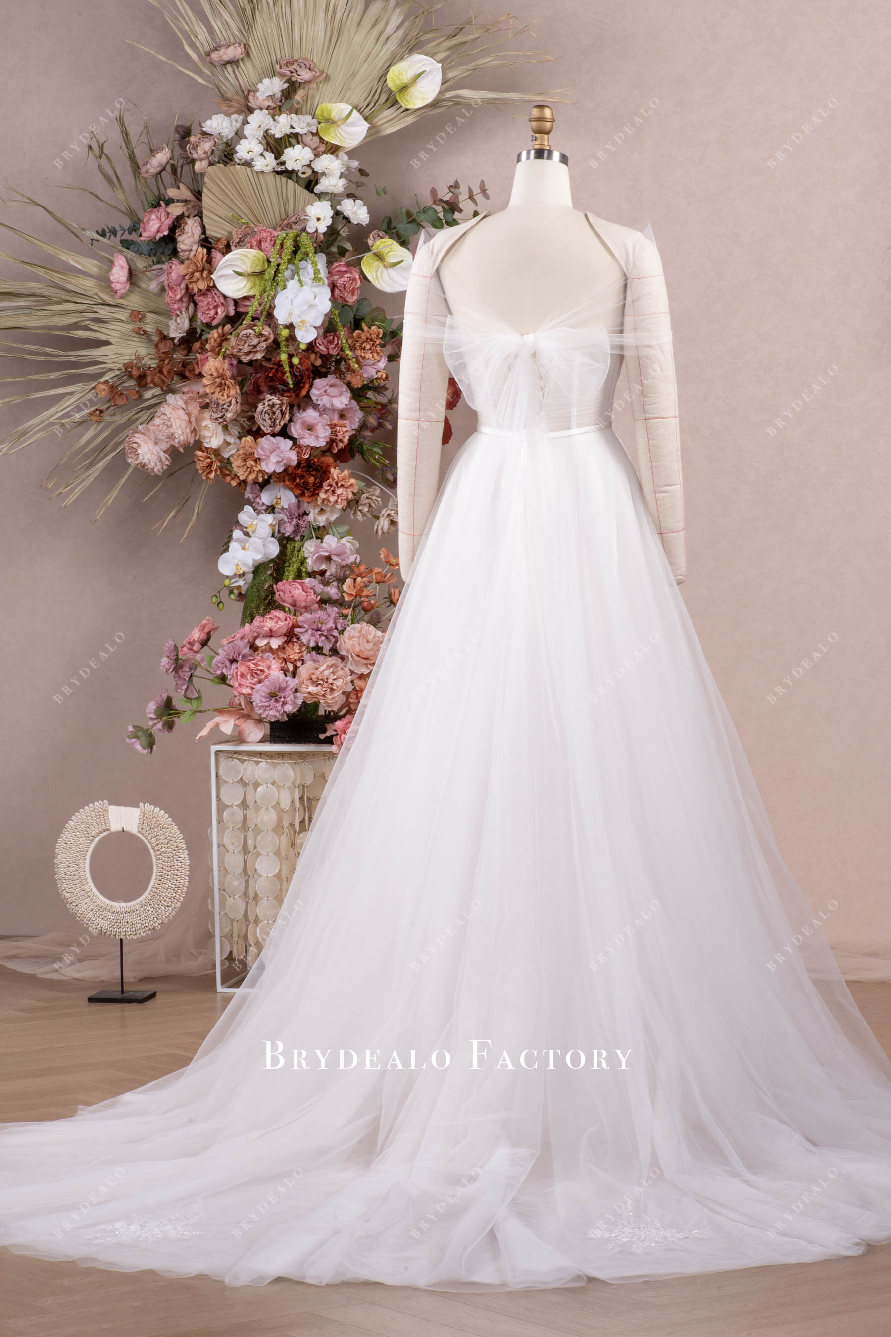 bow long wedding dress with knot accessory