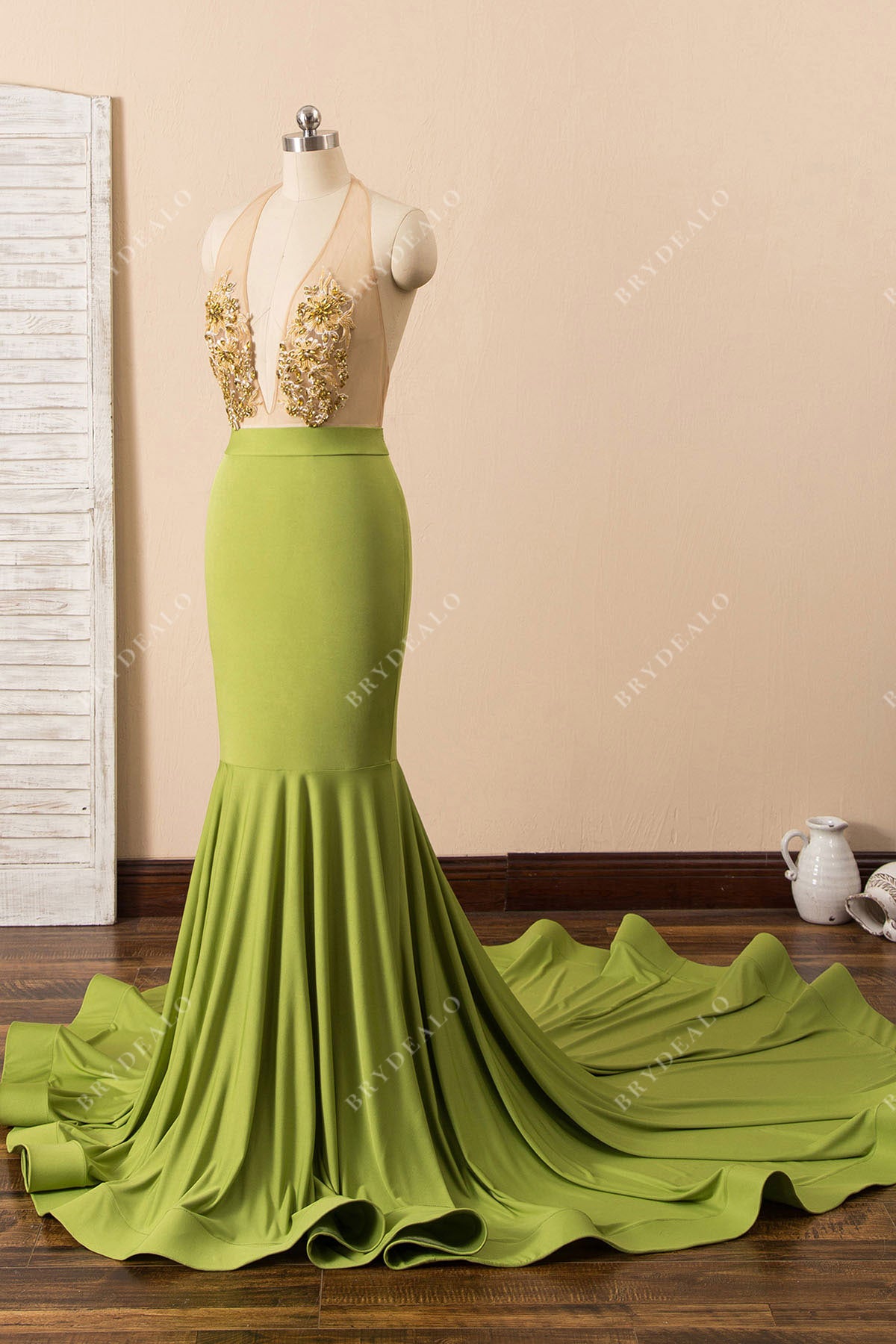 green jersey sleeveless mermaid formal gown