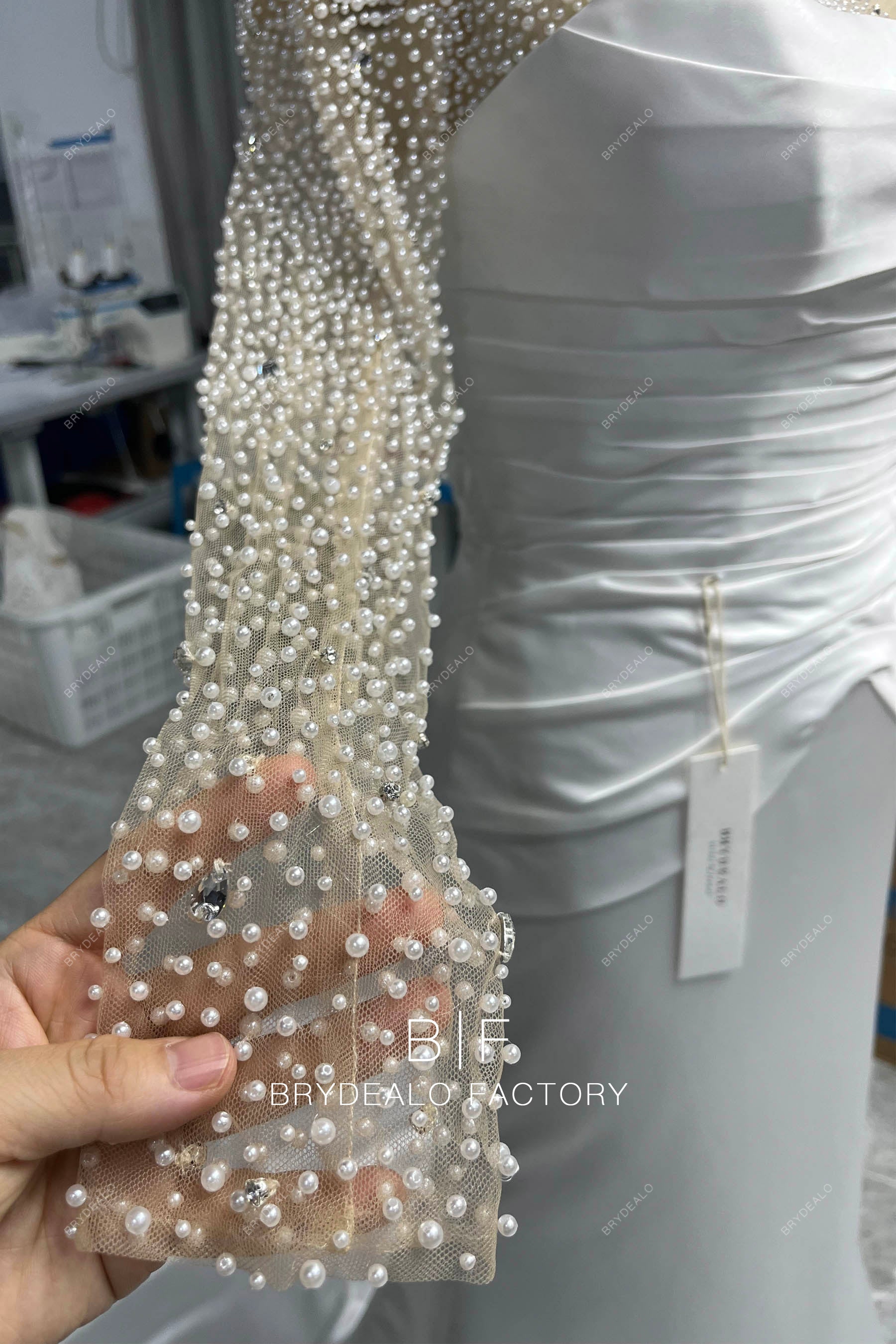 hand-sewn pearl sheer sleeve bridal gown