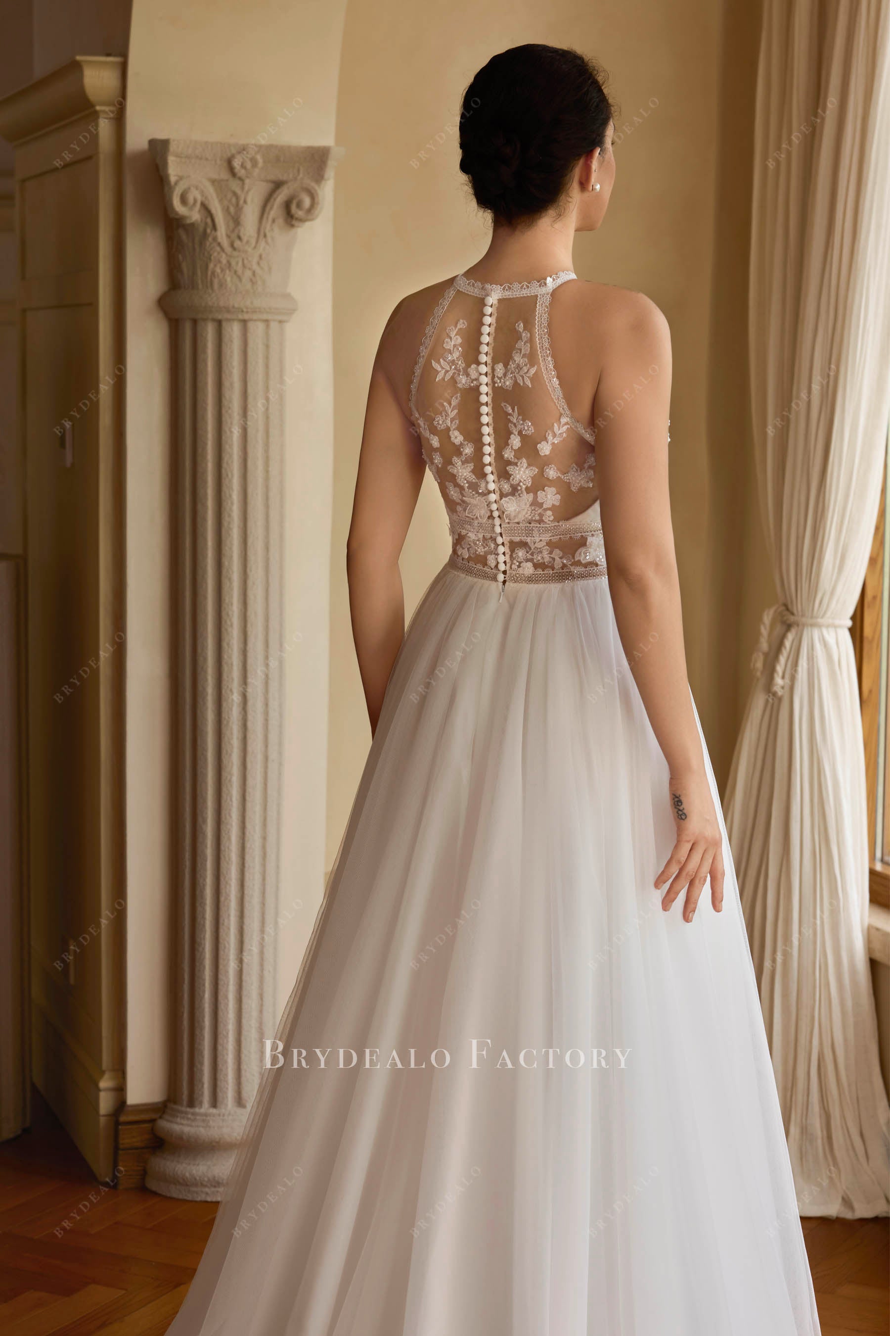 sheer lace buttoned back bridal gown 