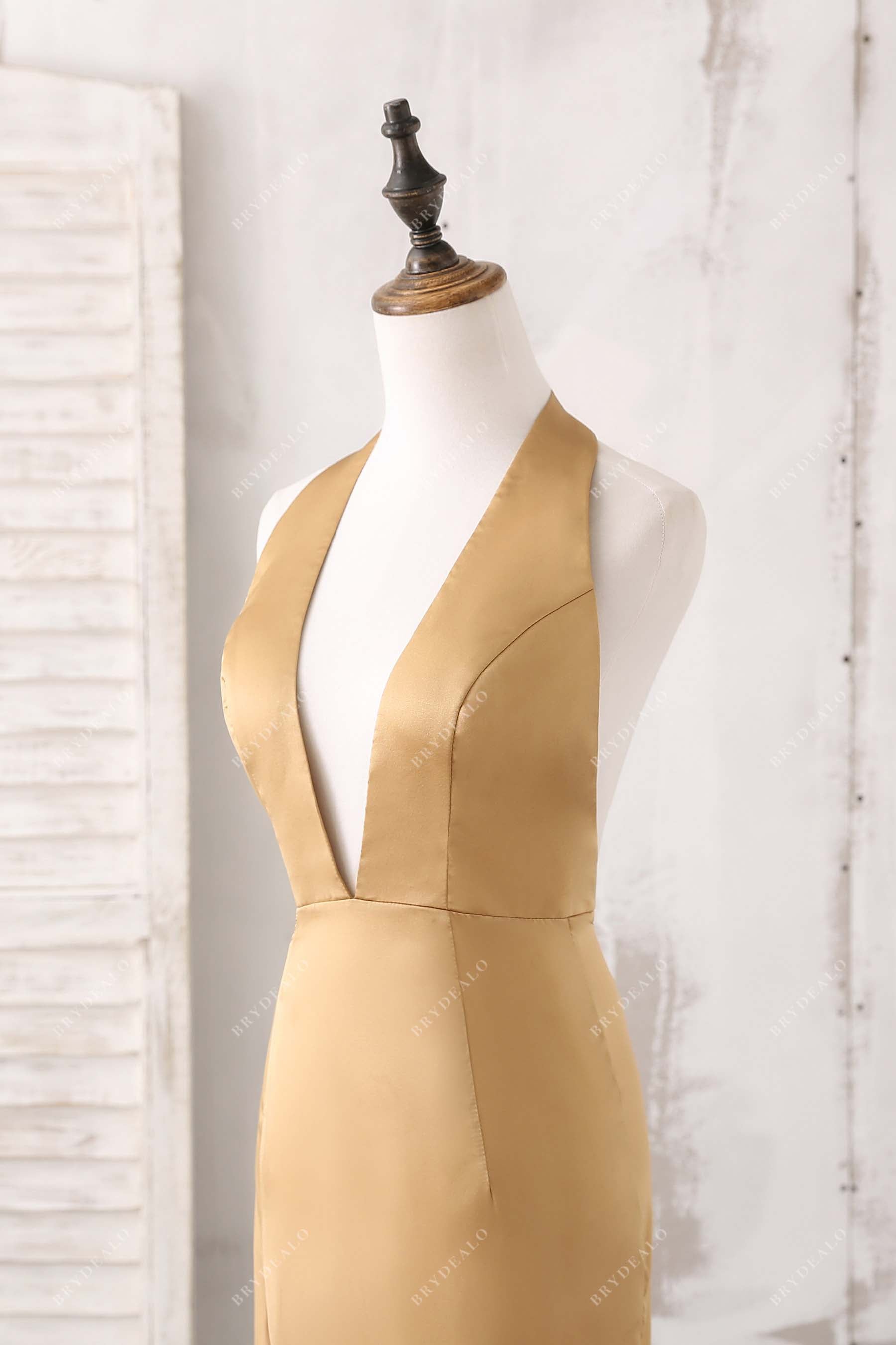 sleeveless plunging neck satin prom dress
