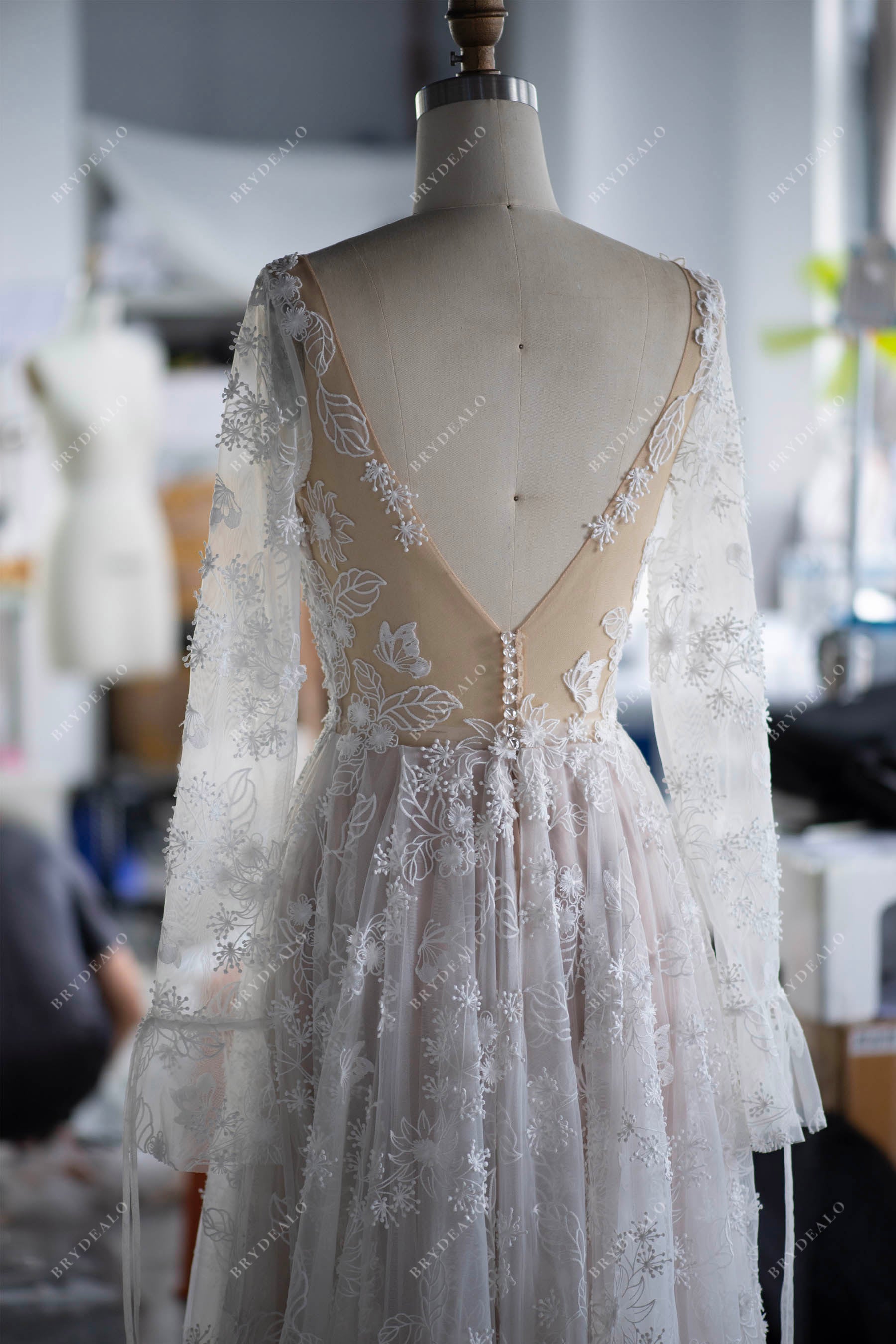 deep v-back illusion bell sleeves wedding dress