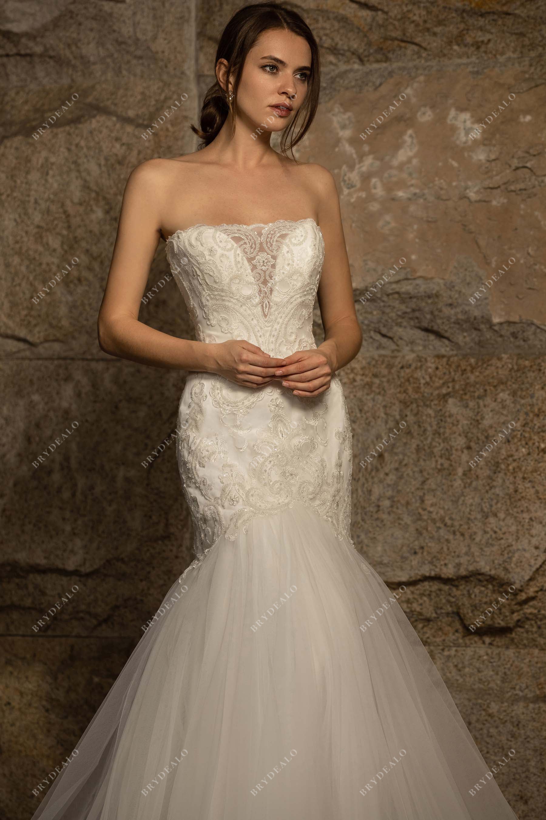 Strapless illusion plunging neck lace fall bridal gown