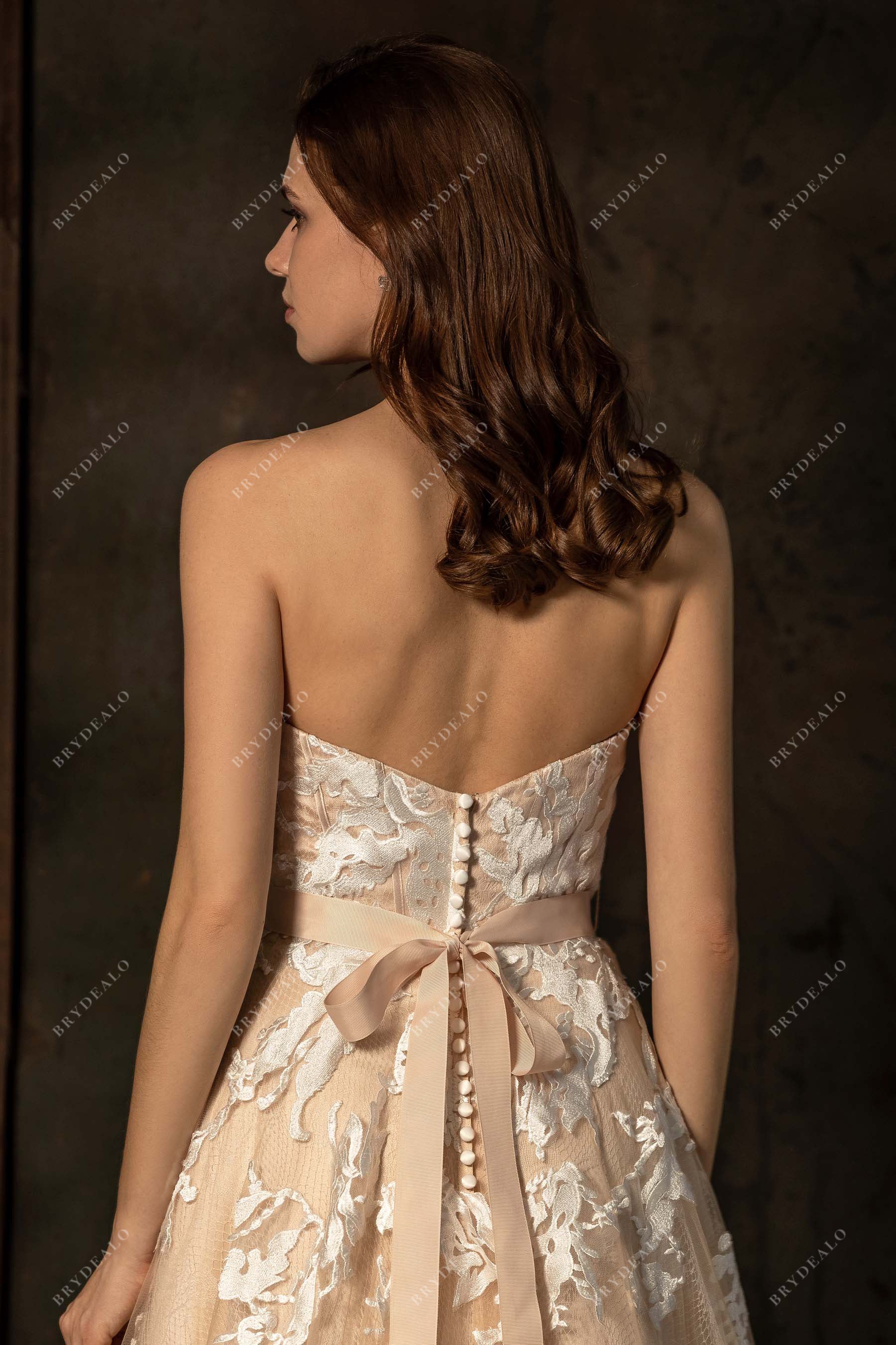 ivory lace overlaid champagne strapless wedding dress