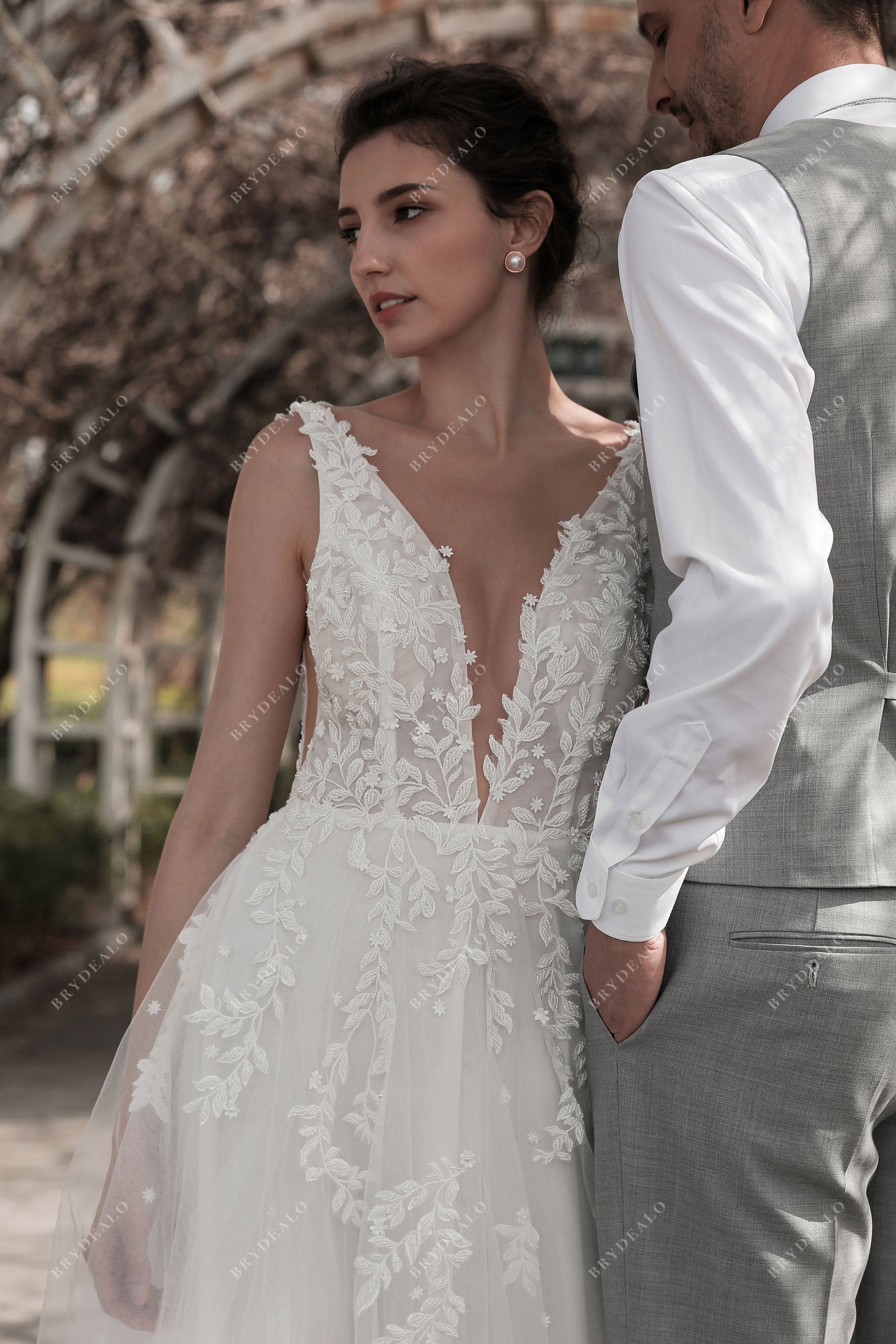 deep V-neck sleeveless lace bridal gown