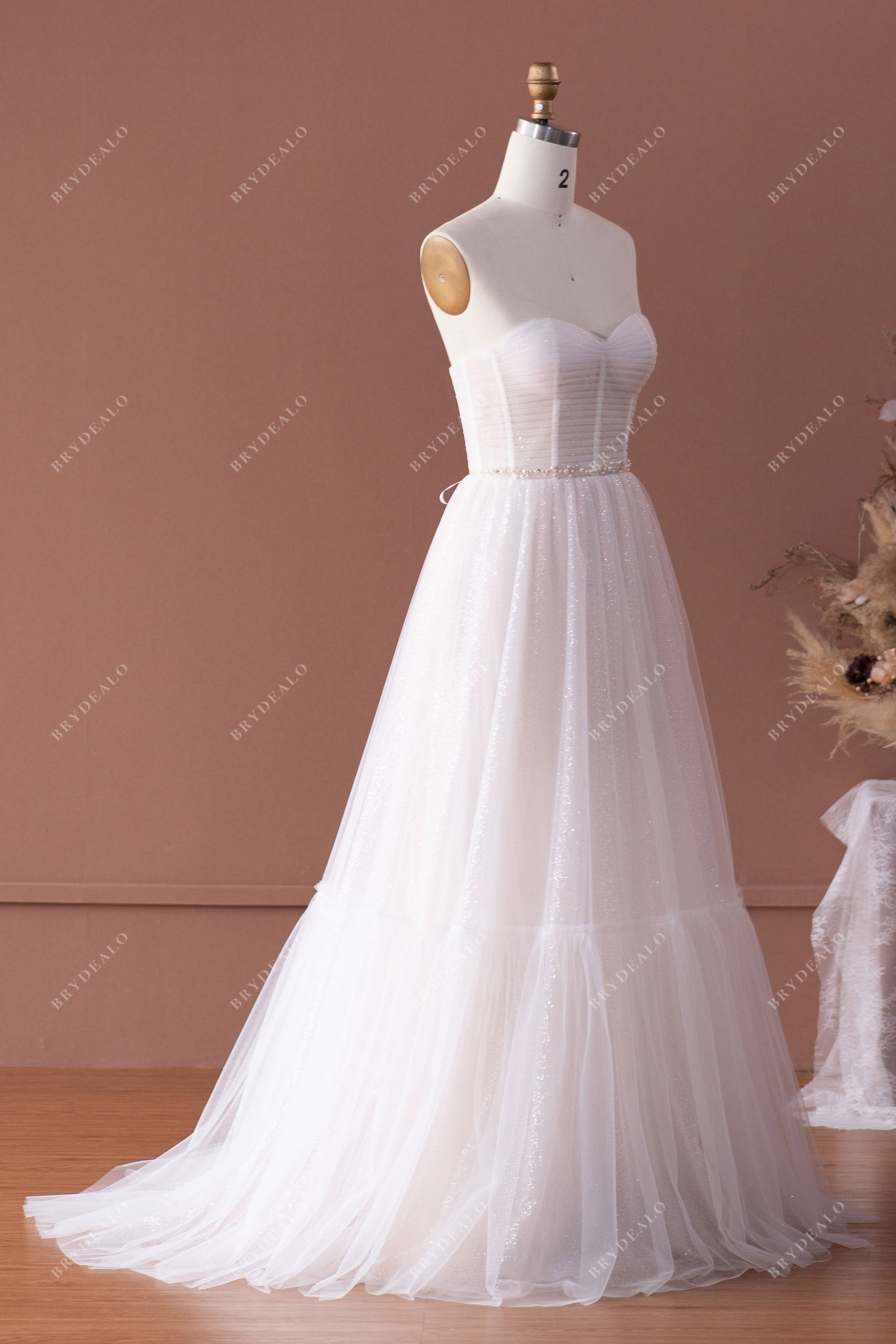 strapless puffy A-line shimmery wedding gown