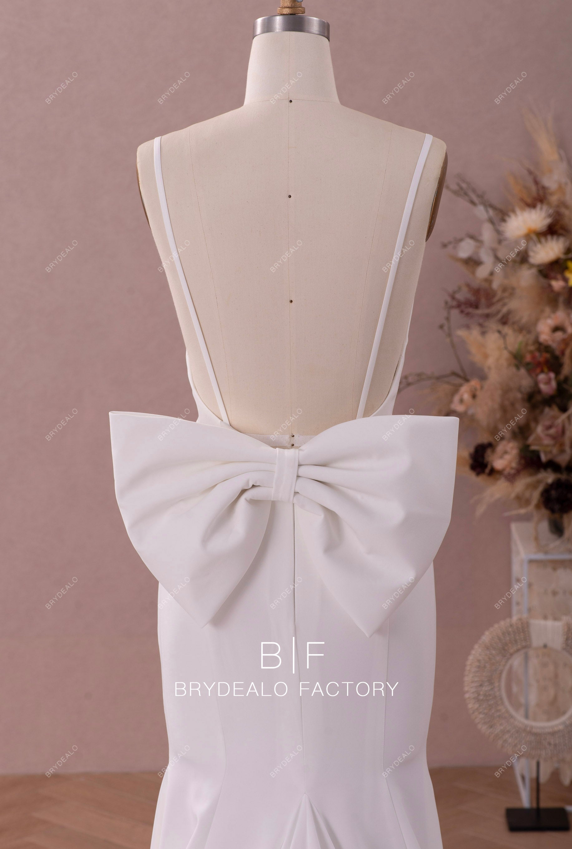 large bow open back trumpet bridal dress