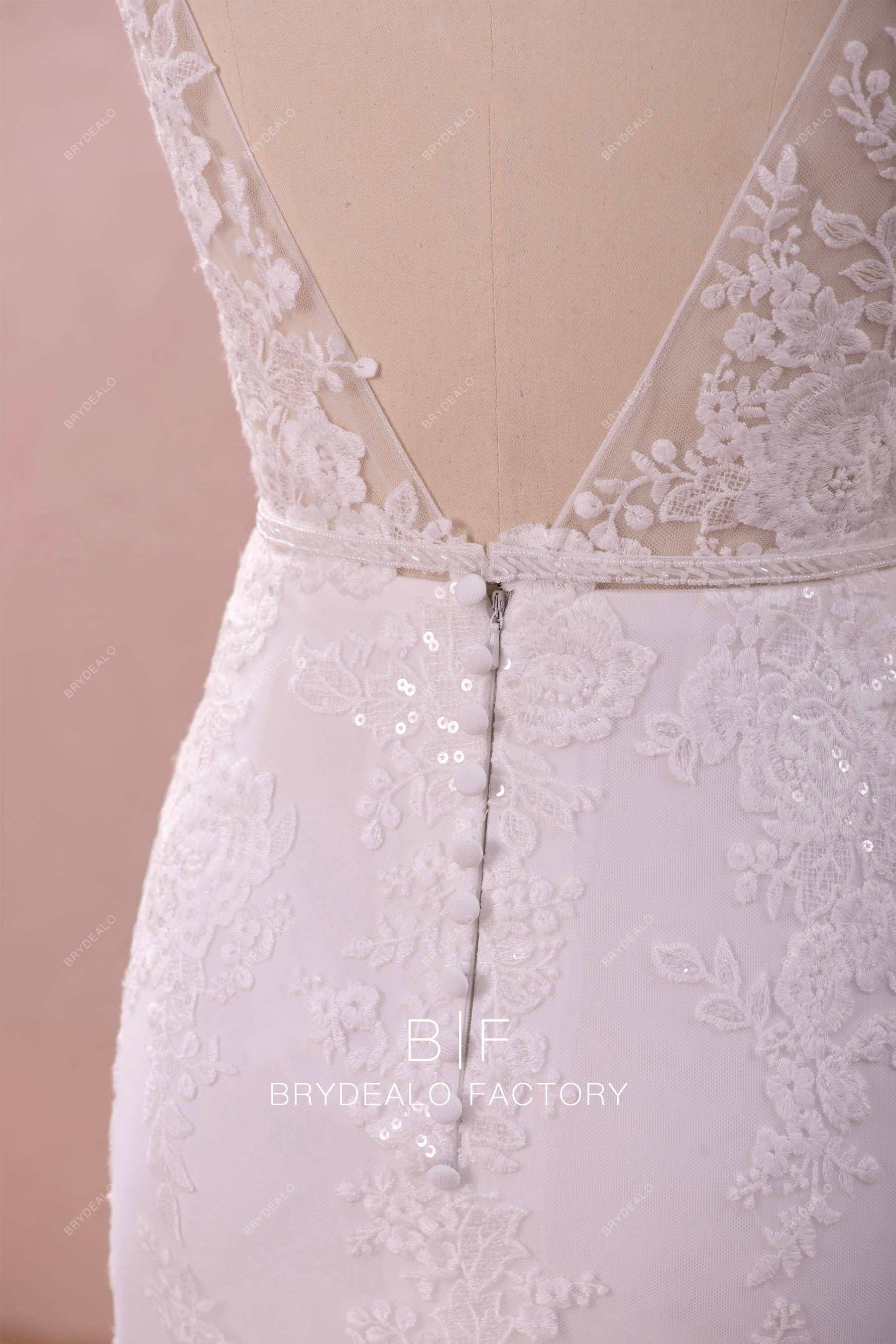 buttoned illusion back bridal gown