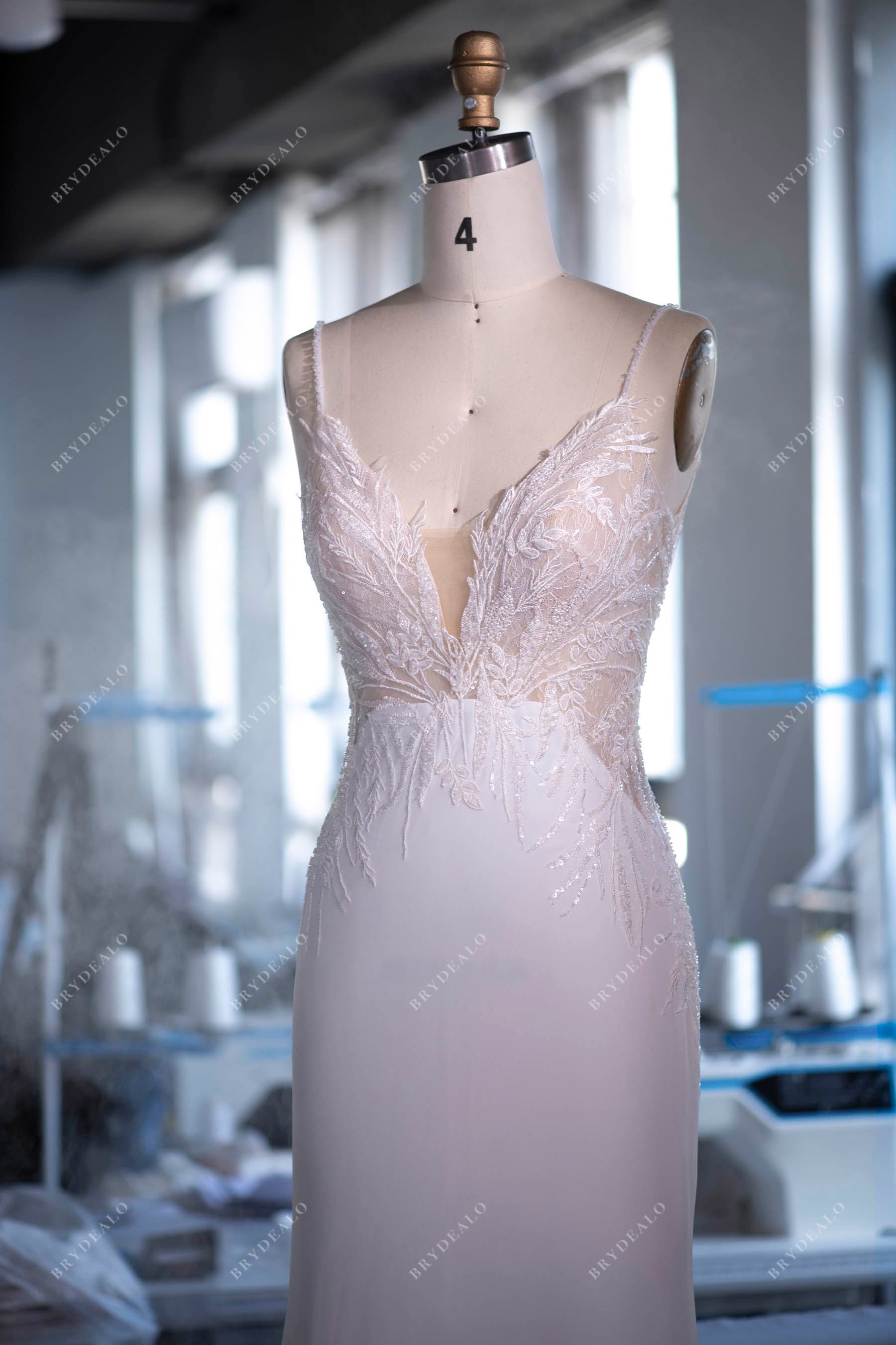 custom-made deep neck sleeveless wedding gown