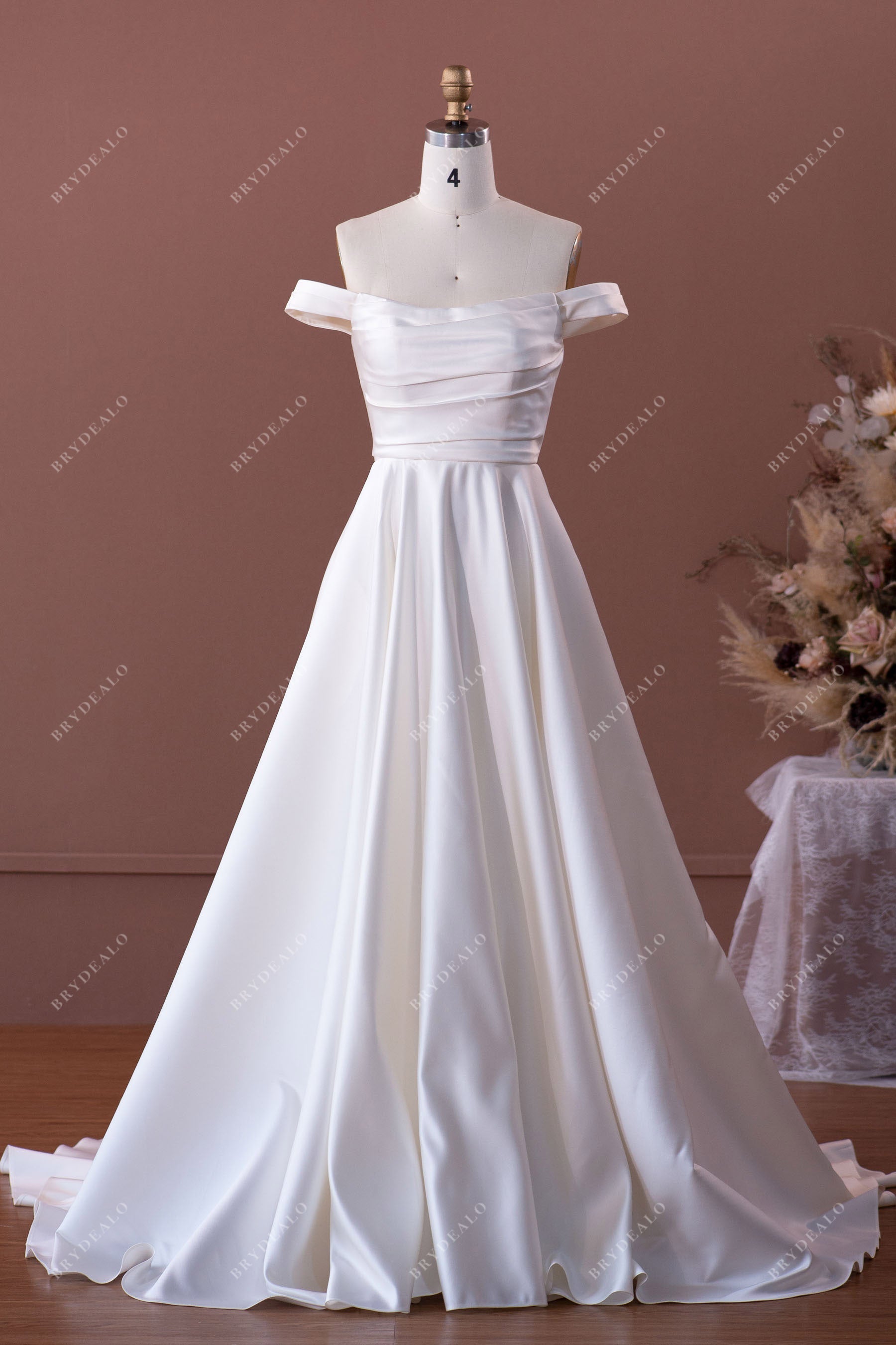 elegant ruched satin off-shoulder wedding dress