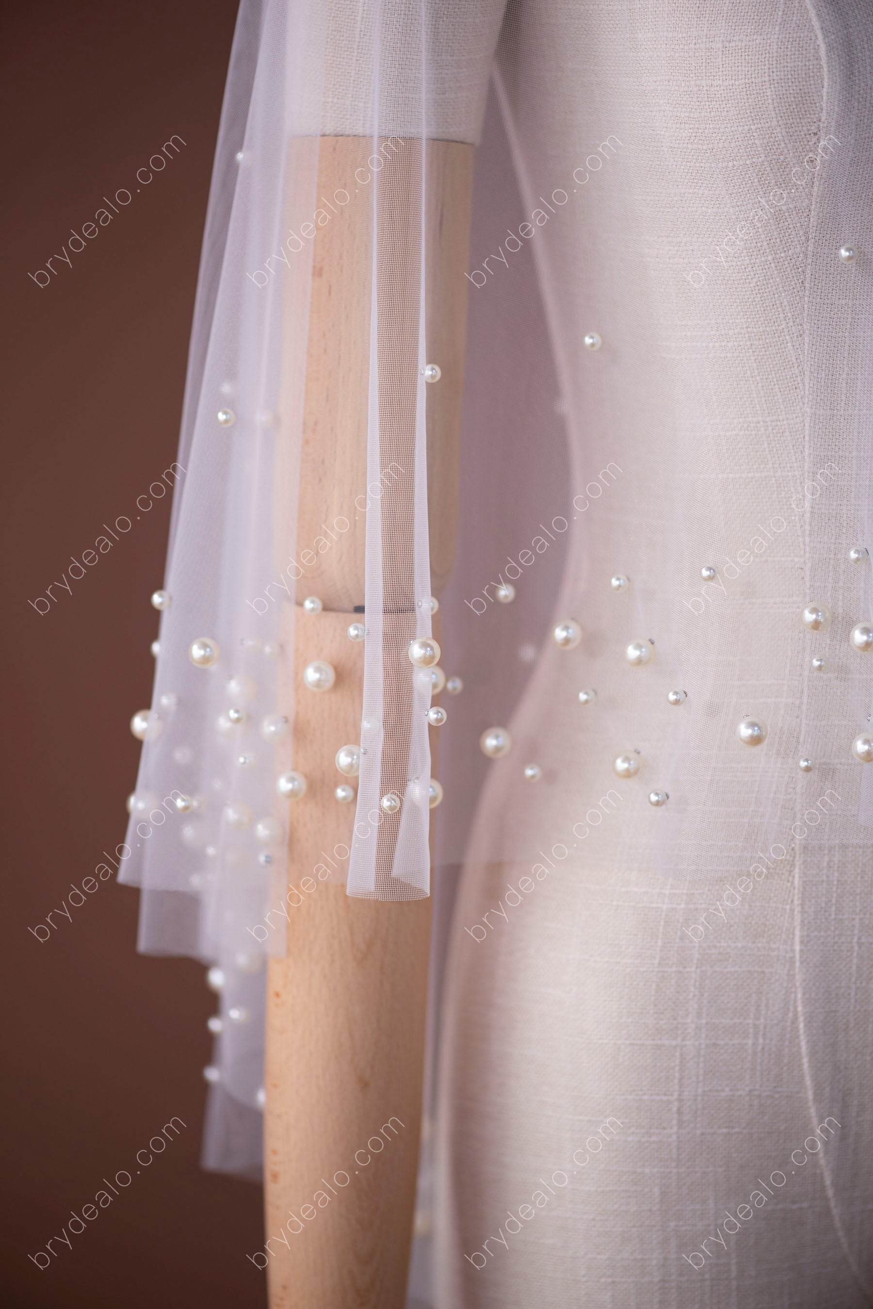 different sized pearls designer wedding cape