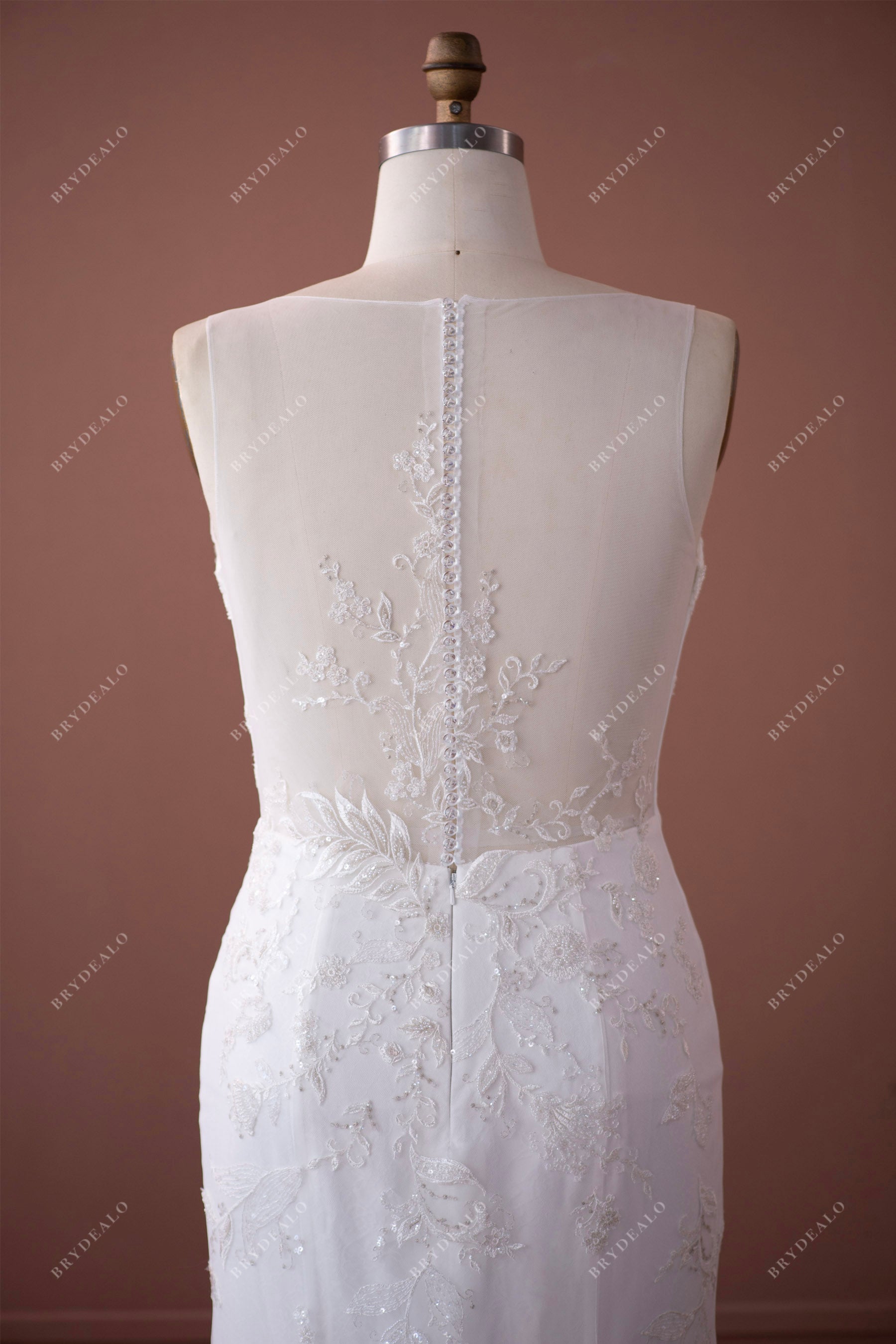 sleeveless illusion buttoned back wedding dress
