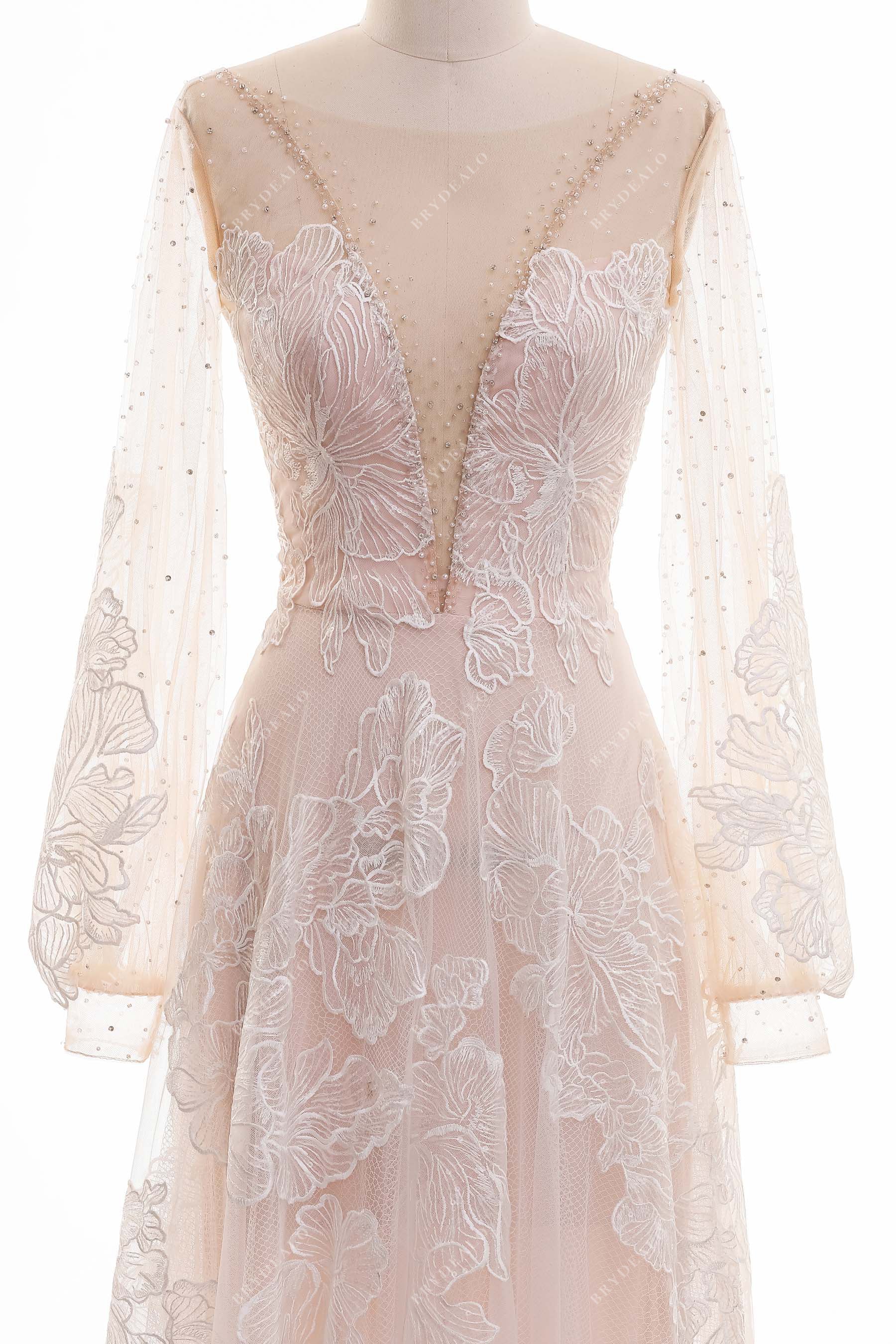 Illusion plunging neck bishop sleeve lace bridal gown