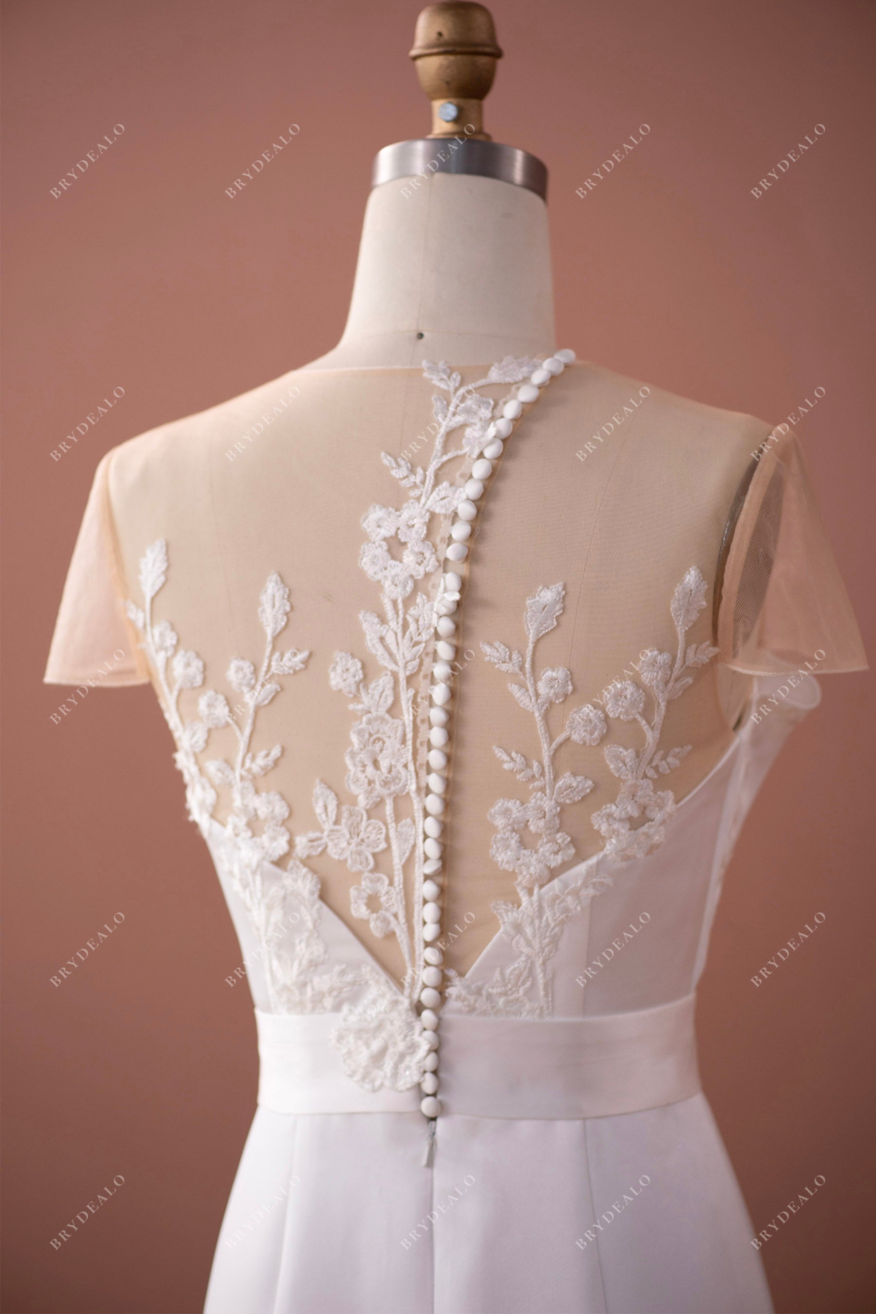 inclined buttoned back unique wedding dress