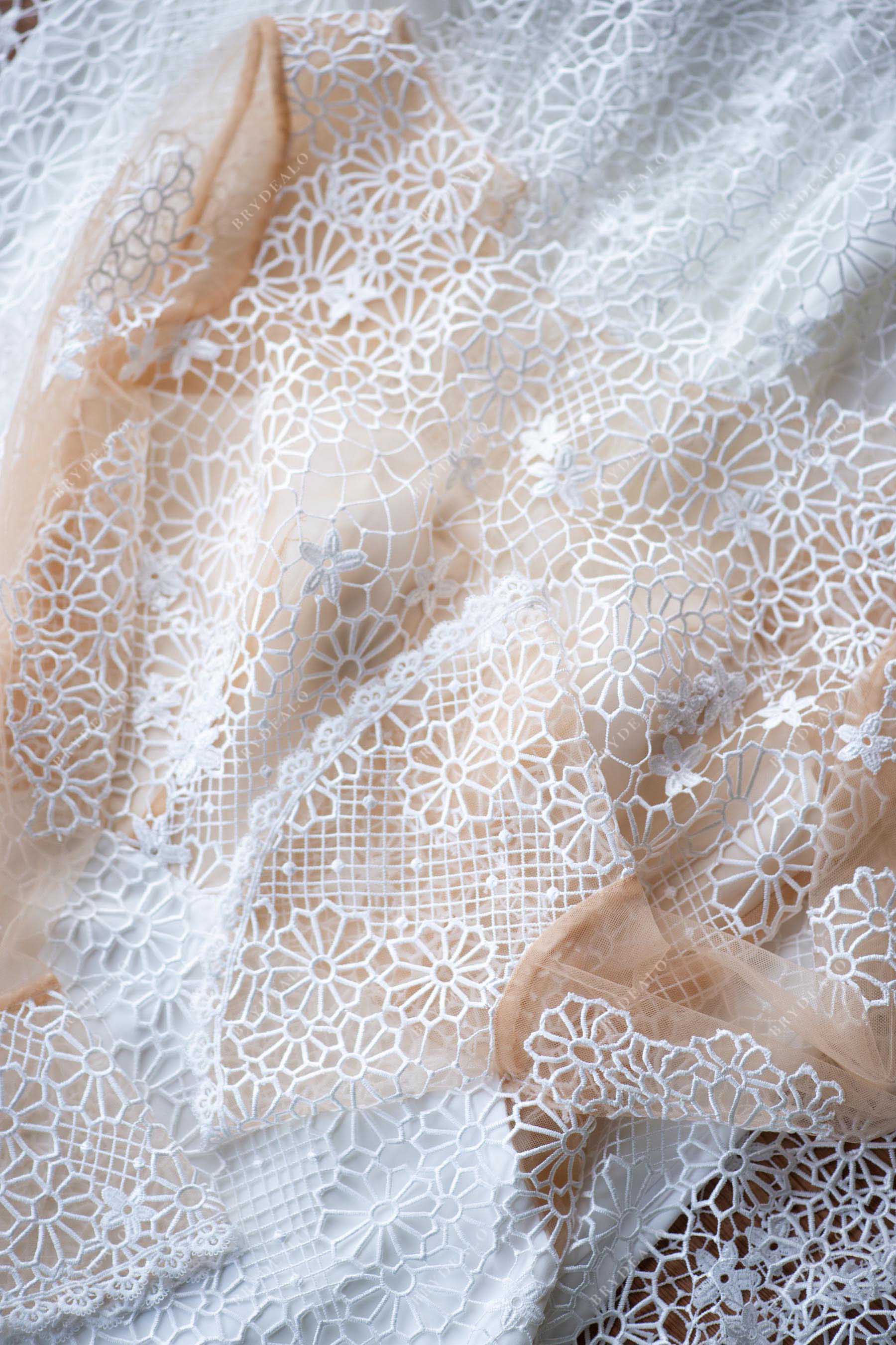 designer ivory snow lace overlaid nude tulle wedding gown