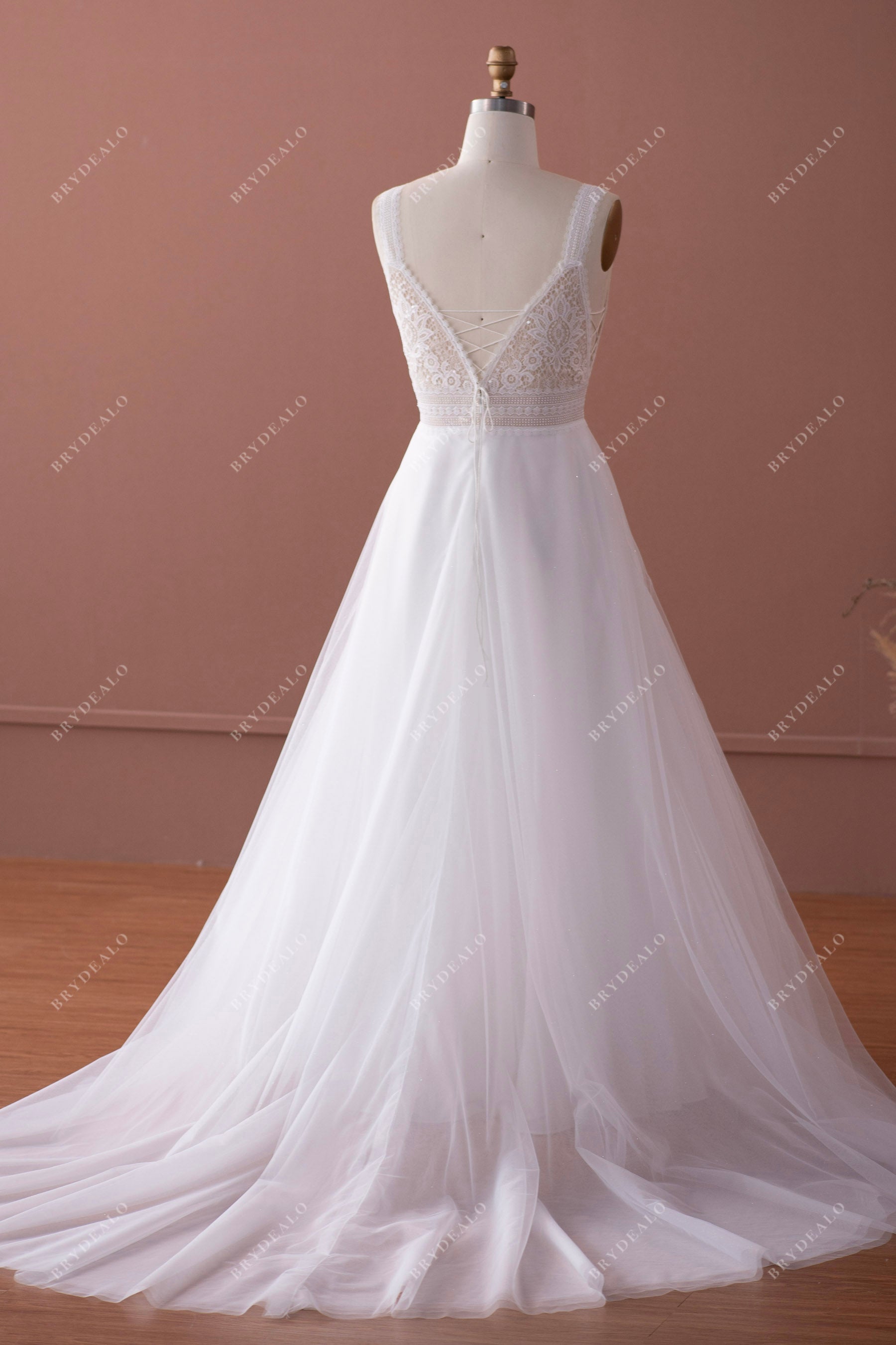 open V-back long train designer lace wedding gown