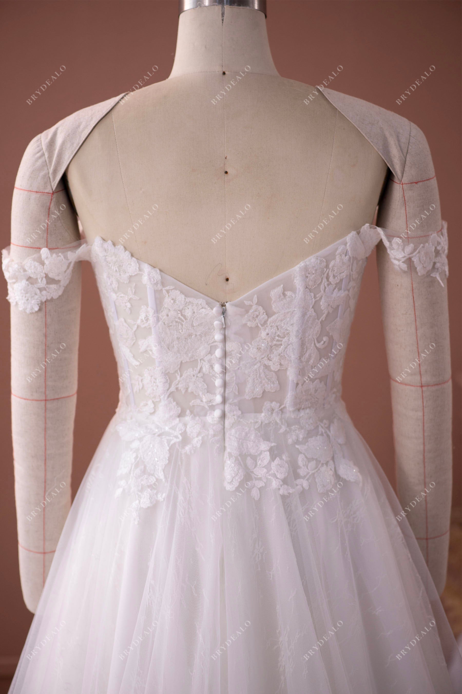V-back off shoulder visible boning destination wedding dress