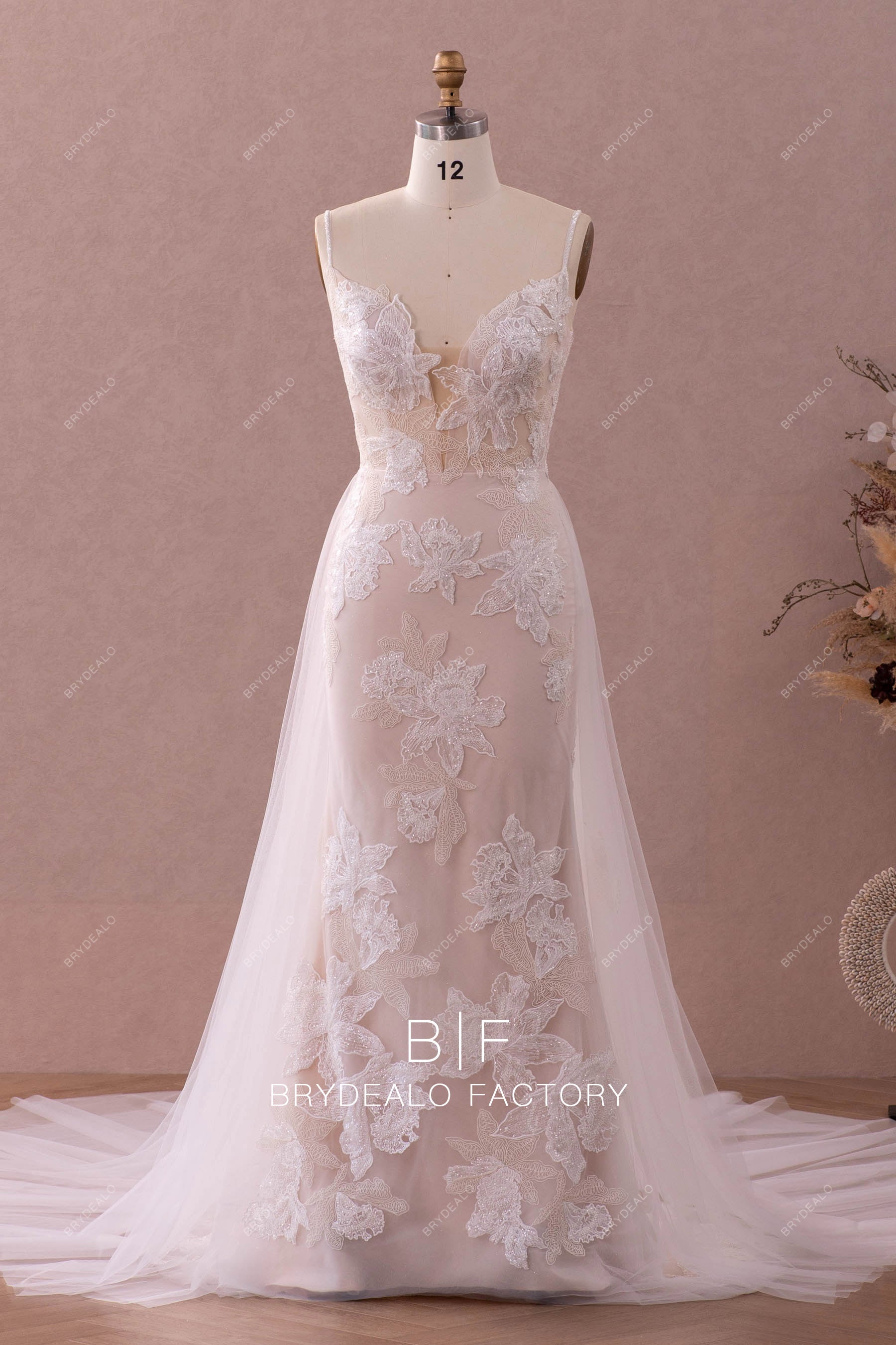 designer plunging beaded lace wedding dress with overskirt