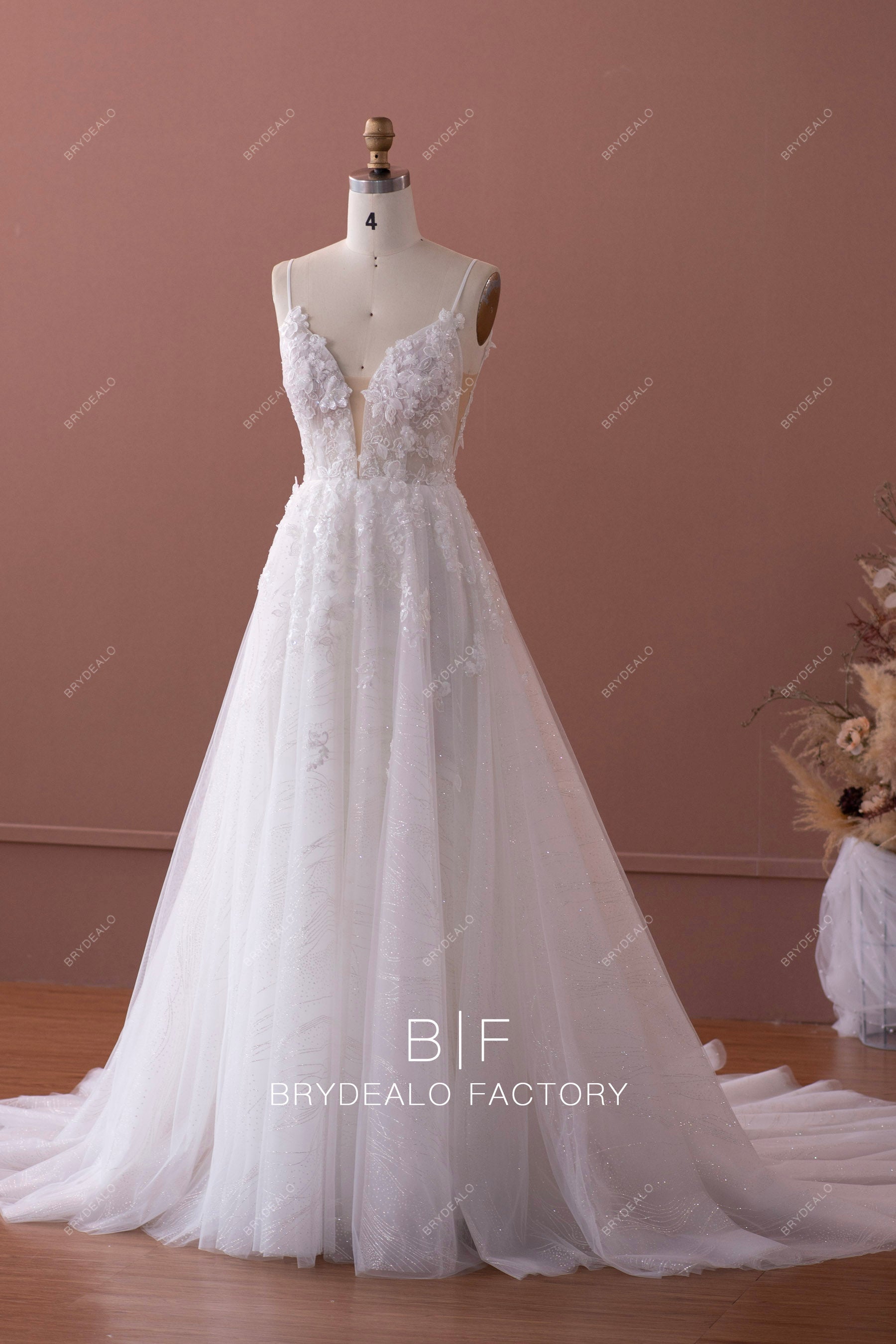 sleeveless plunging neck destination wedding gown