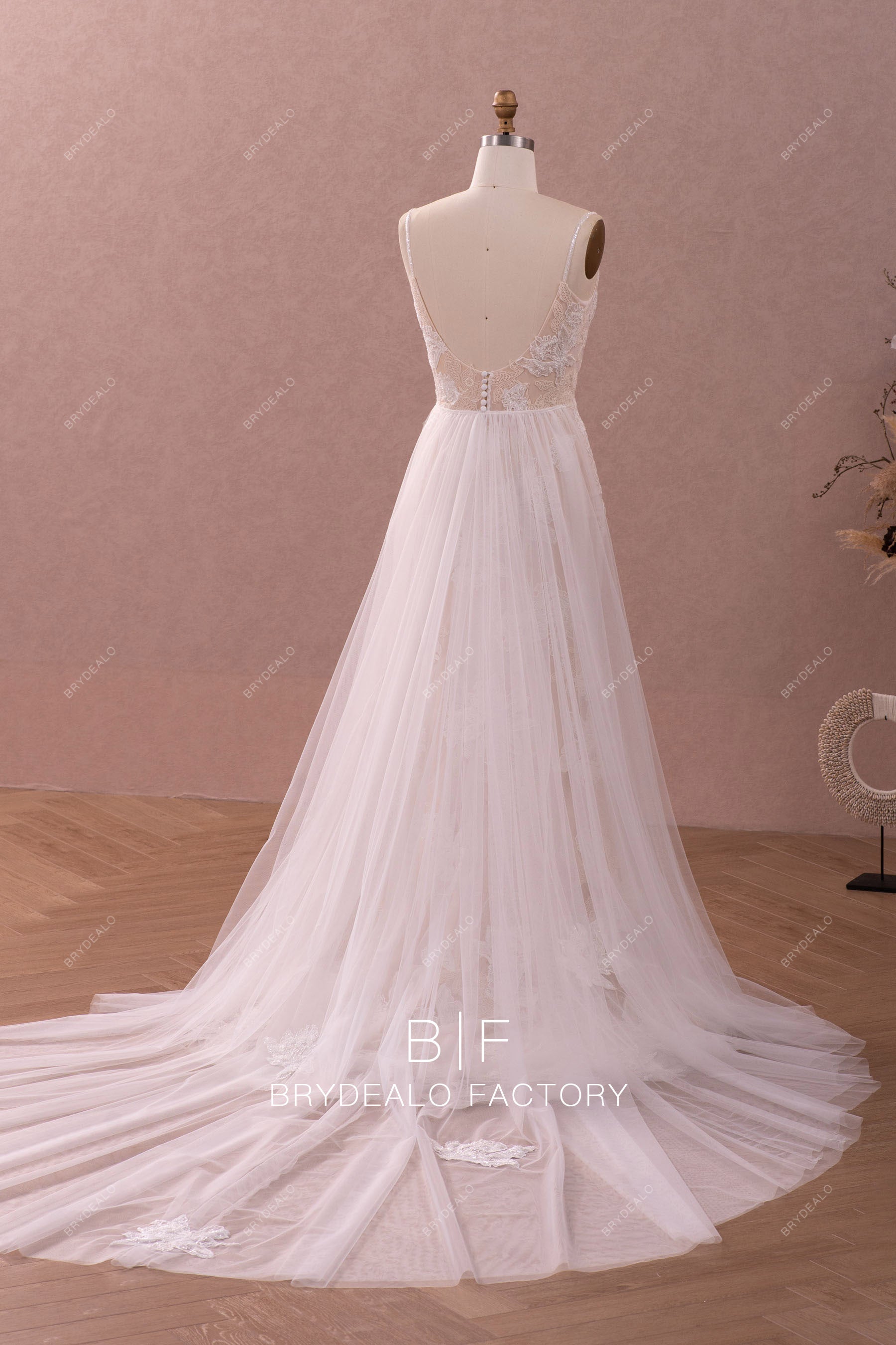 removable tulle overskirt sleeveless wedding dress