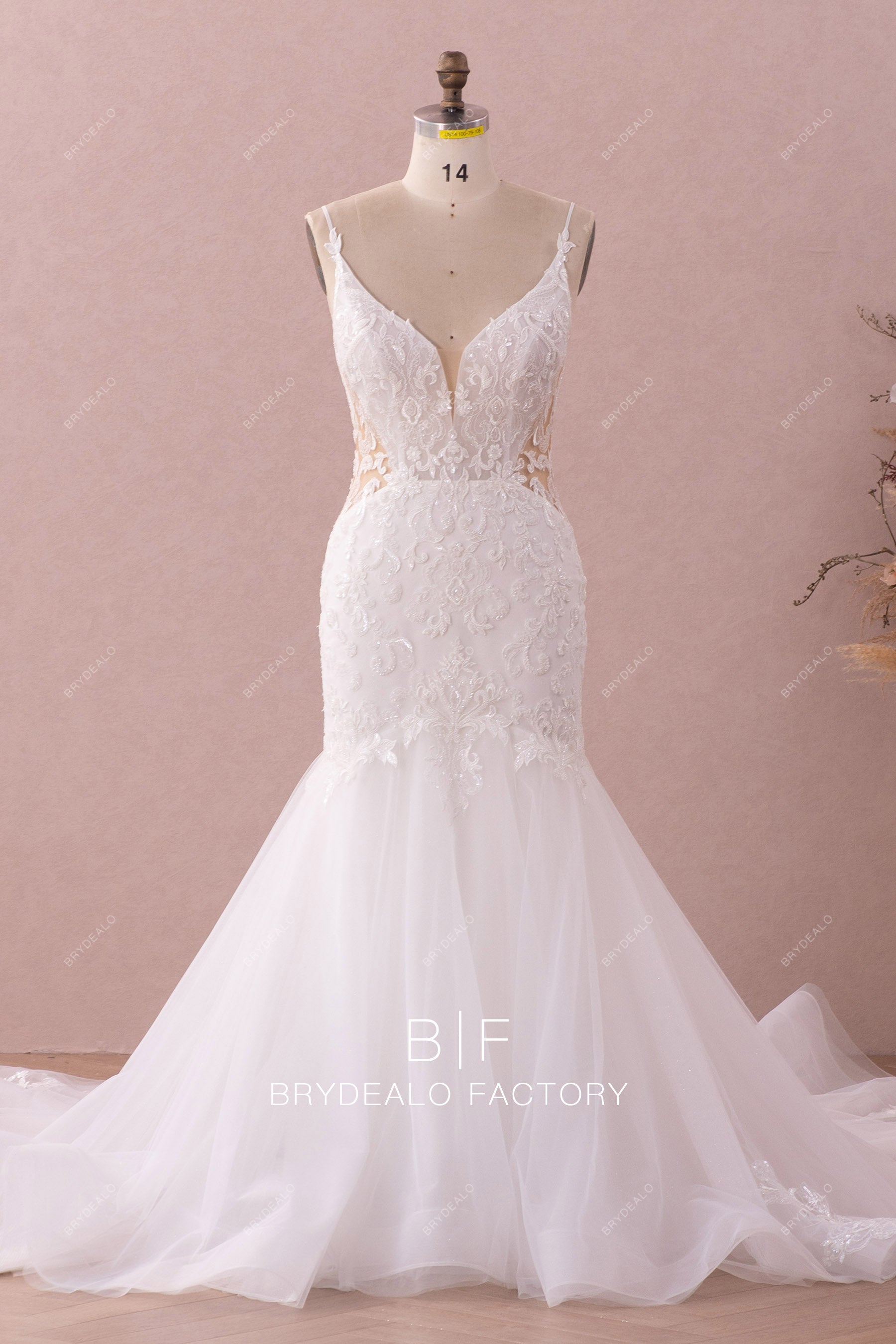 plunging neck sleeveless mermaid beaded lace wedding gown
