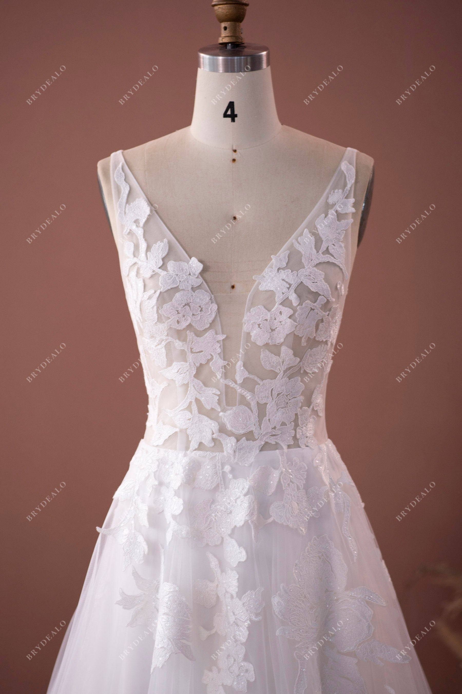 plunging neck sleeveless lace strap destination  wedding dress