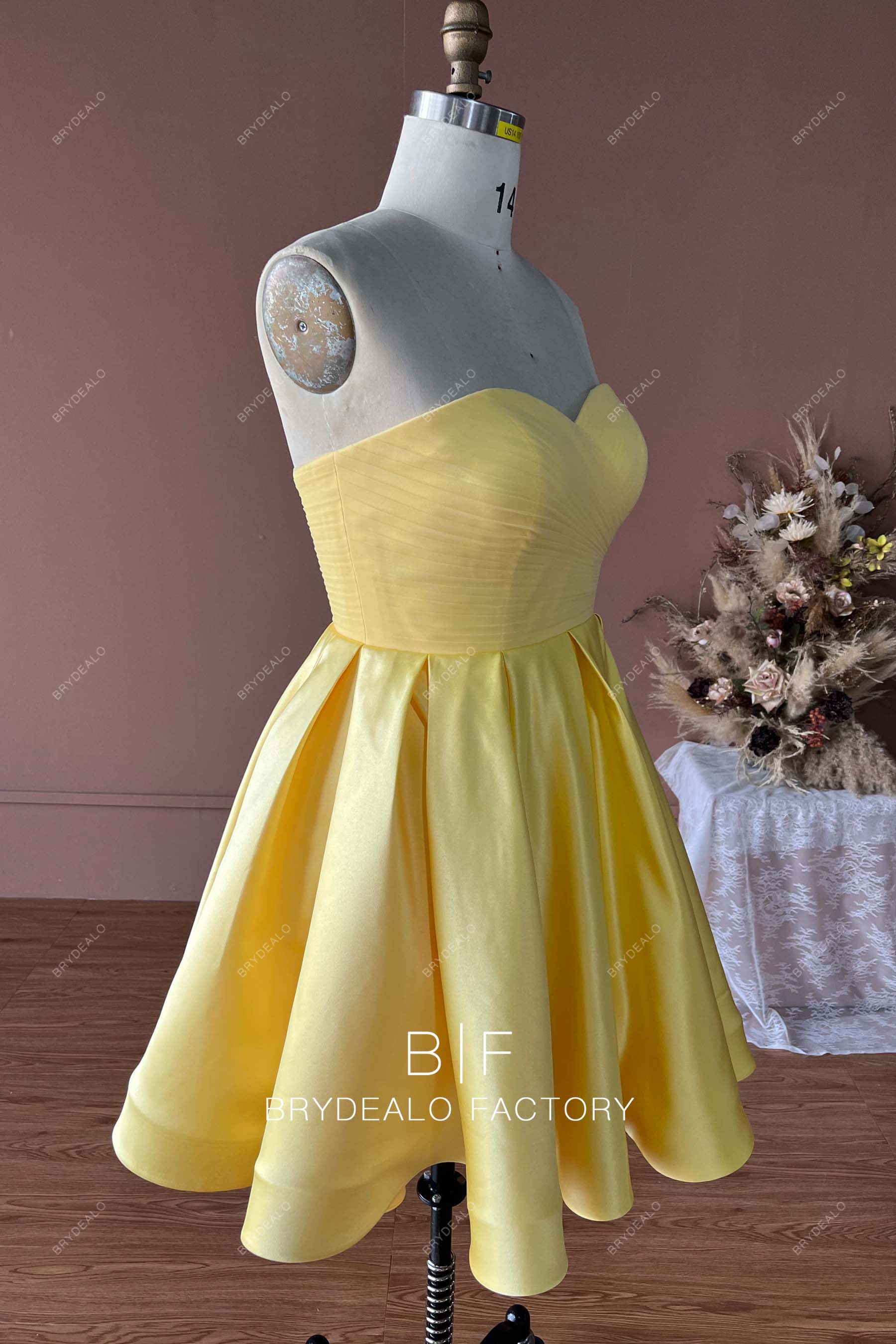 strapless yellow satin pleated short homecoming gown