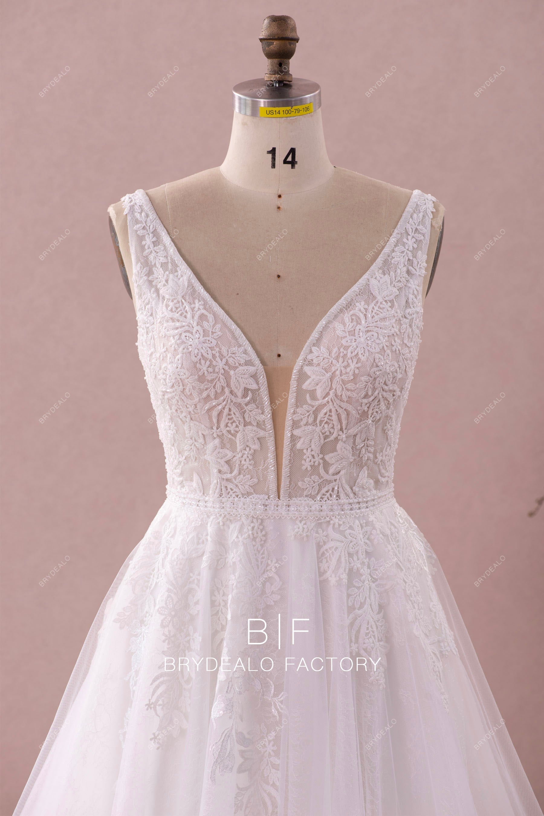 sleeveless beaded plunging neck princess wedding dress