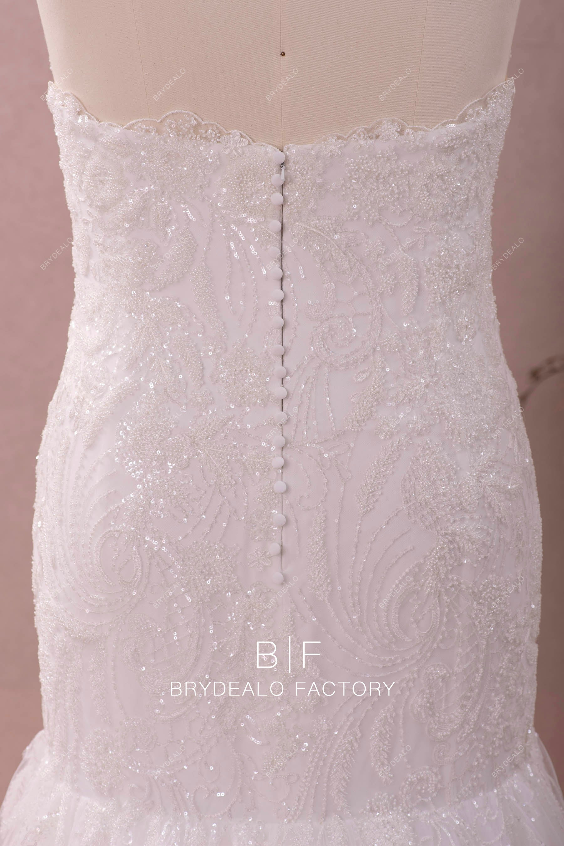 strapless buttoned back wedding gown