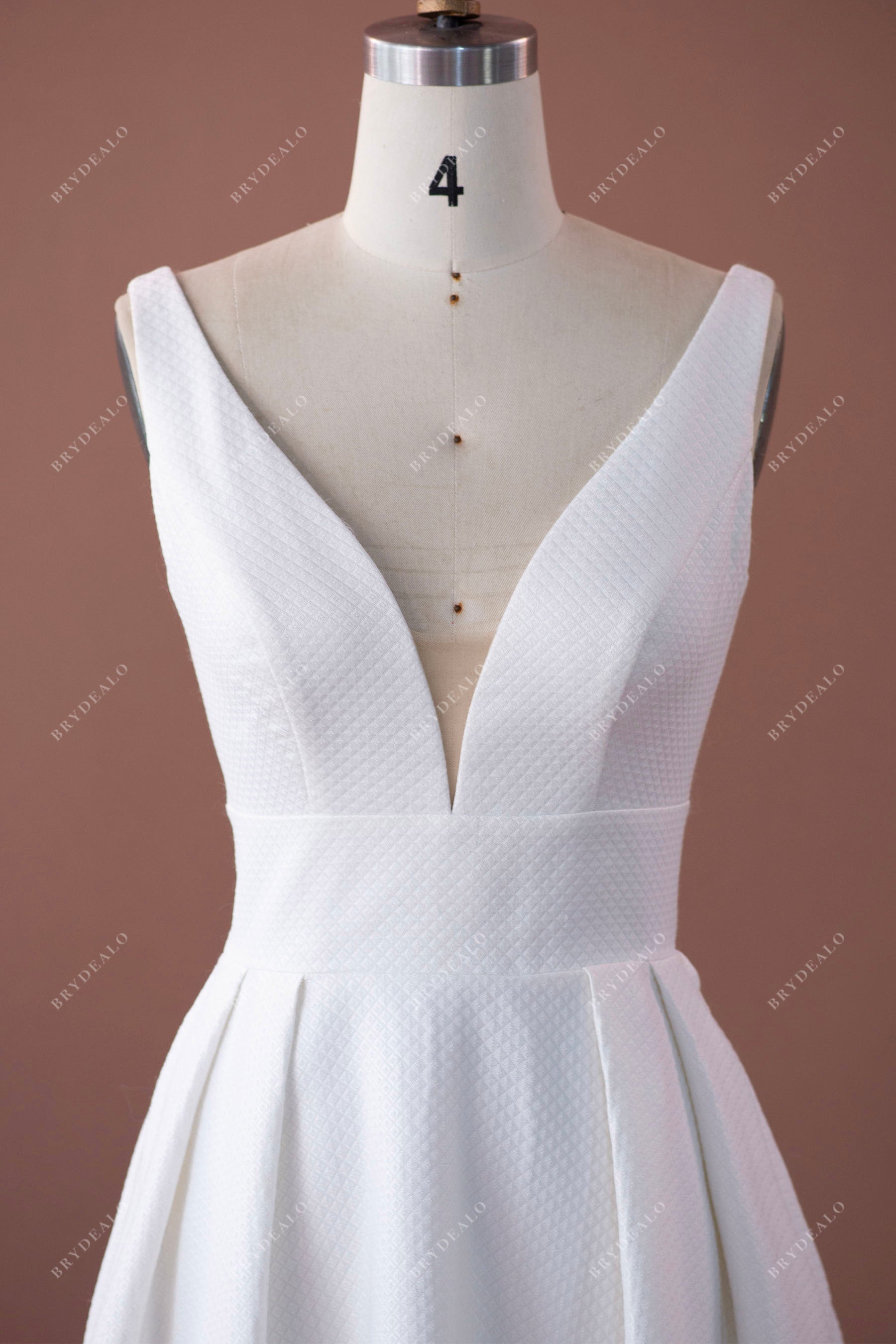 sleeveless plunging neck textured bridal gown