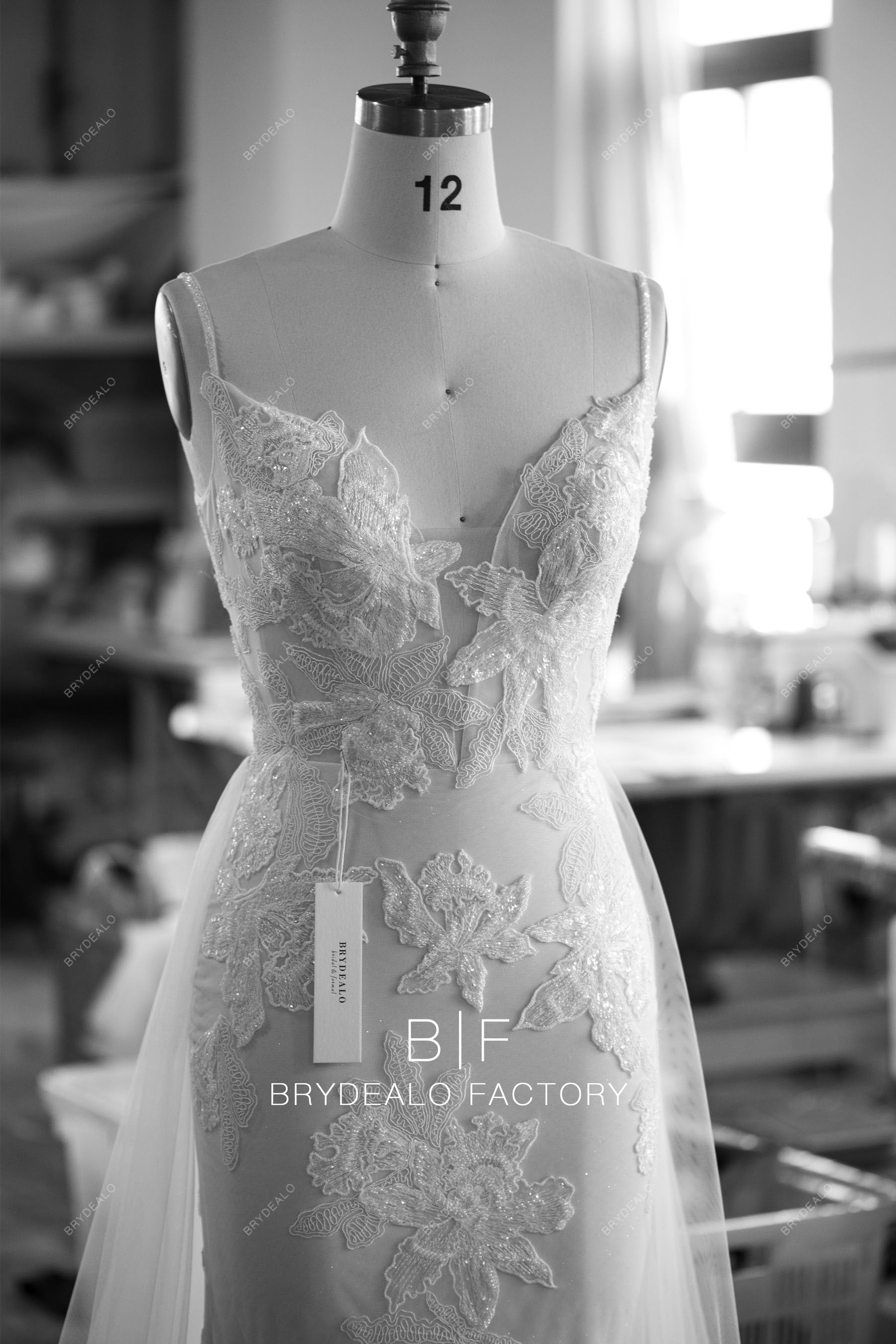 designer beaded straps plunging overskirt wedding dress