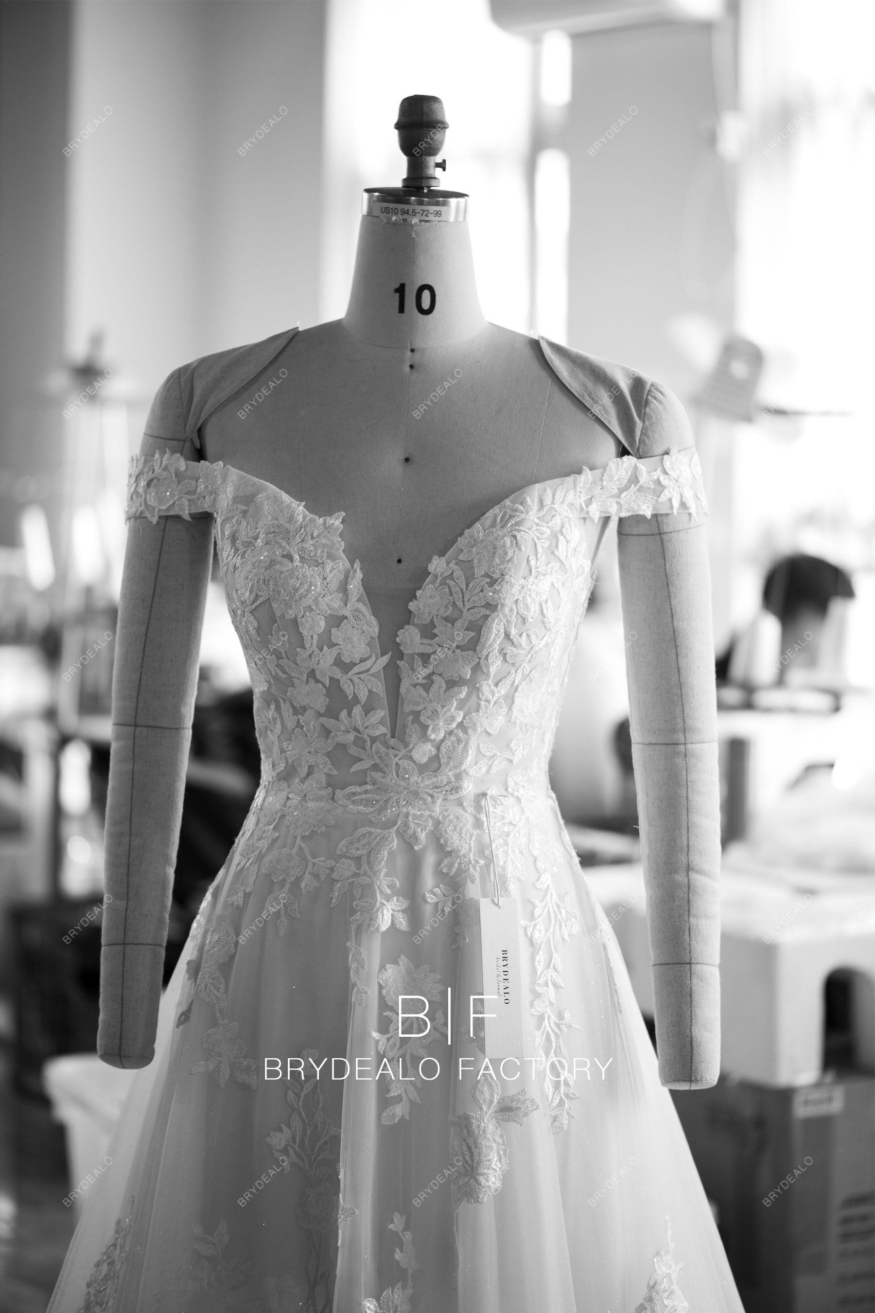 designer off shoulder plunging A-line wedding dress
