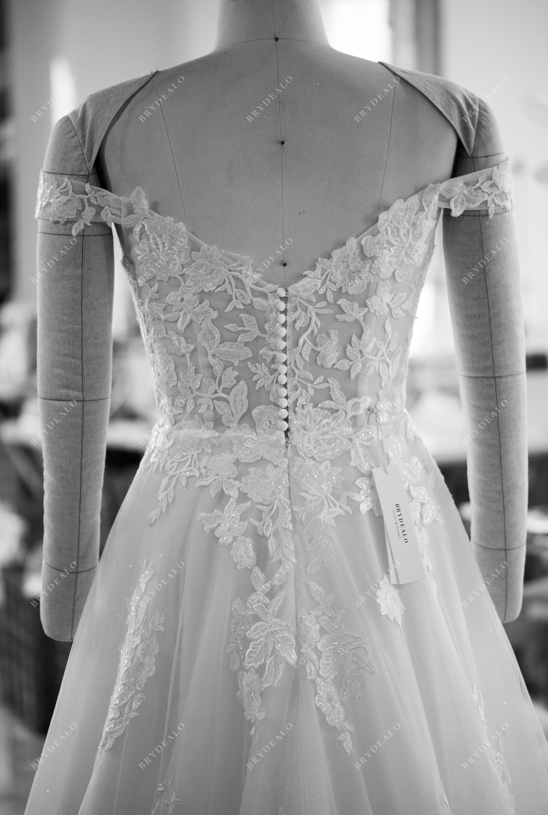 designer V-back off shoulder shimmery lace bridal gown