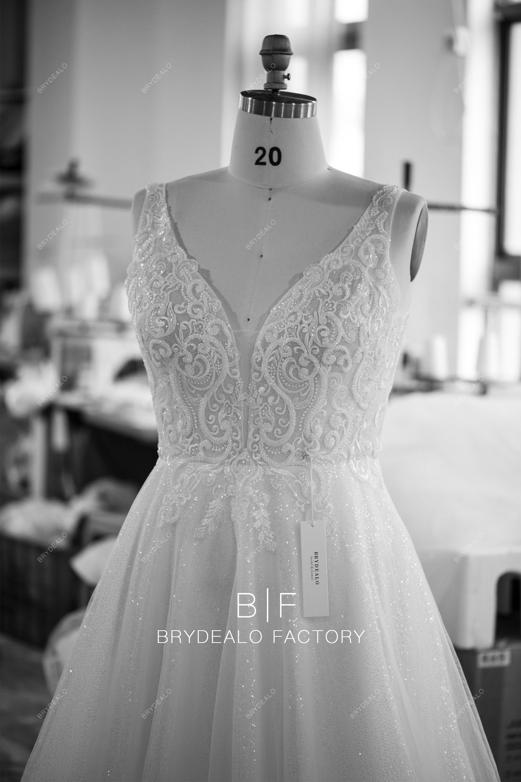 designer plunging beaded lace A-line wedding dress