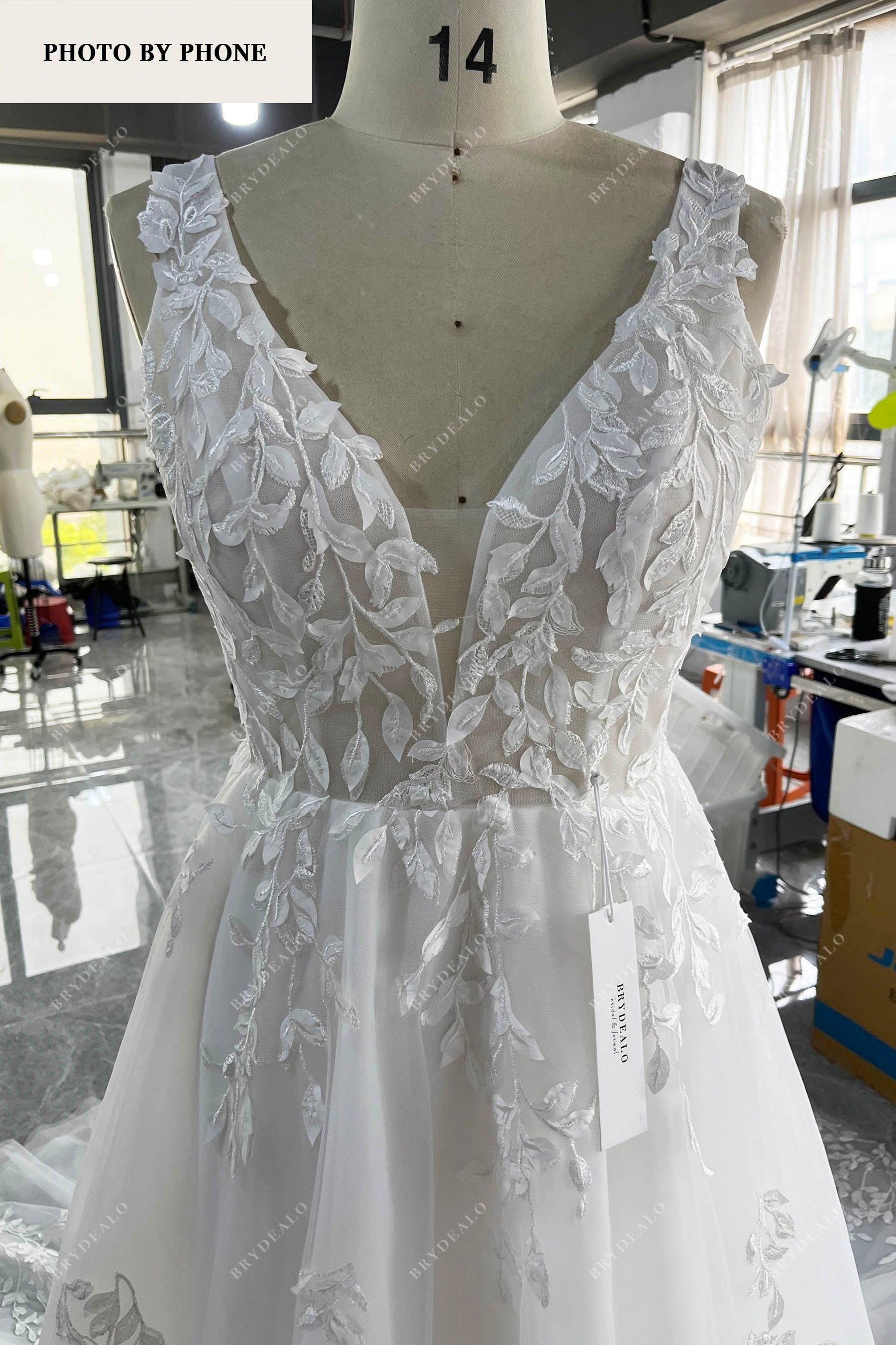 plunging neck sleeveless lace wedding dress real production photo