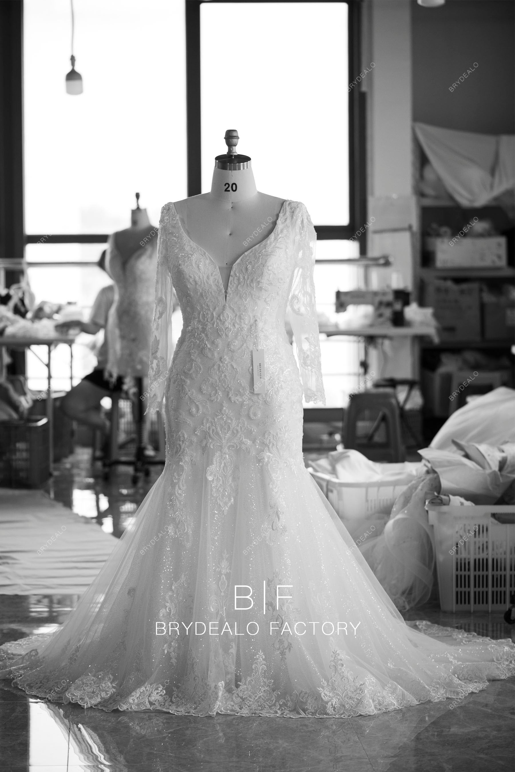 plunging neck plus size sleeved trumpet wedding dress