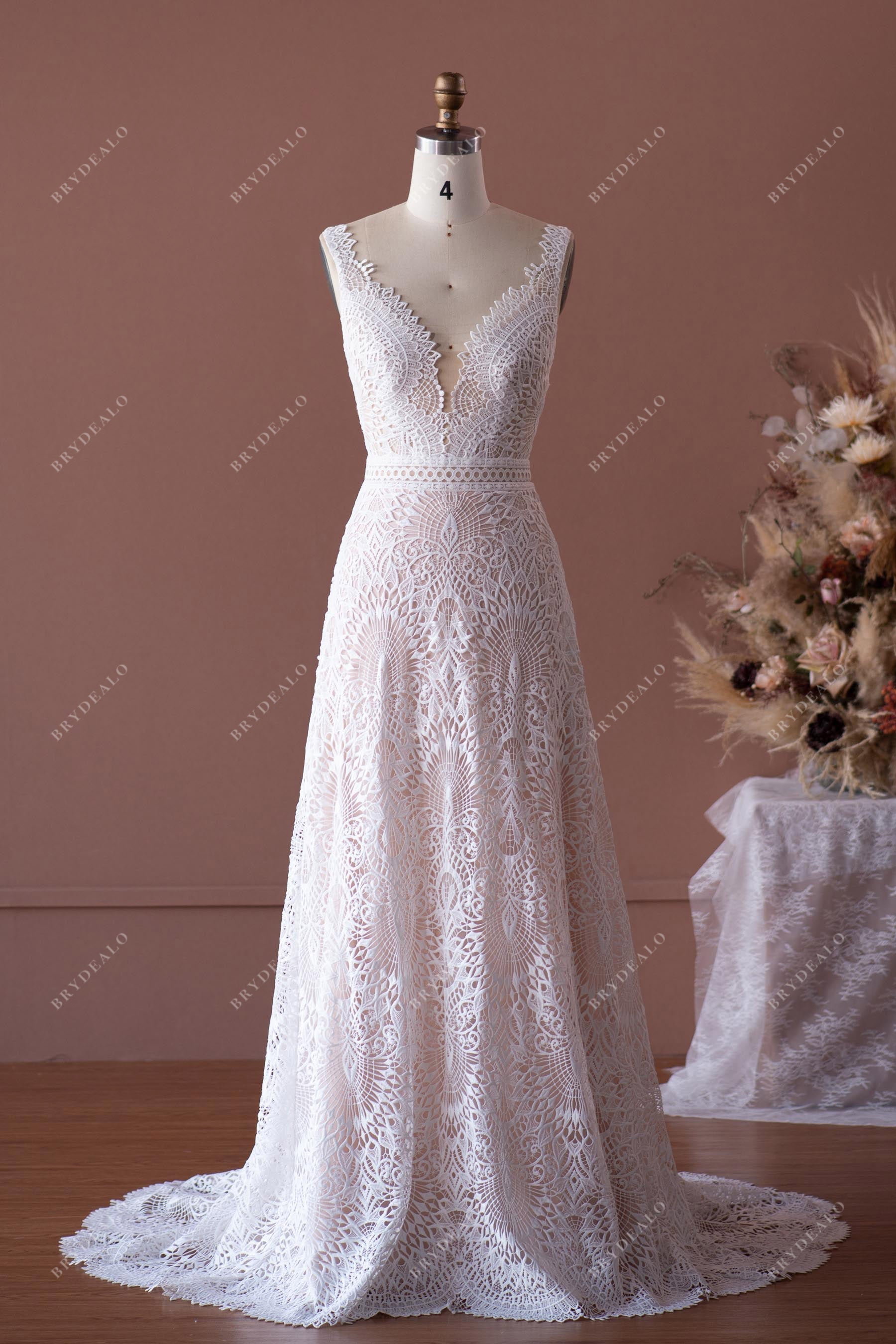 designer lace A-line sleeveless wedding gown